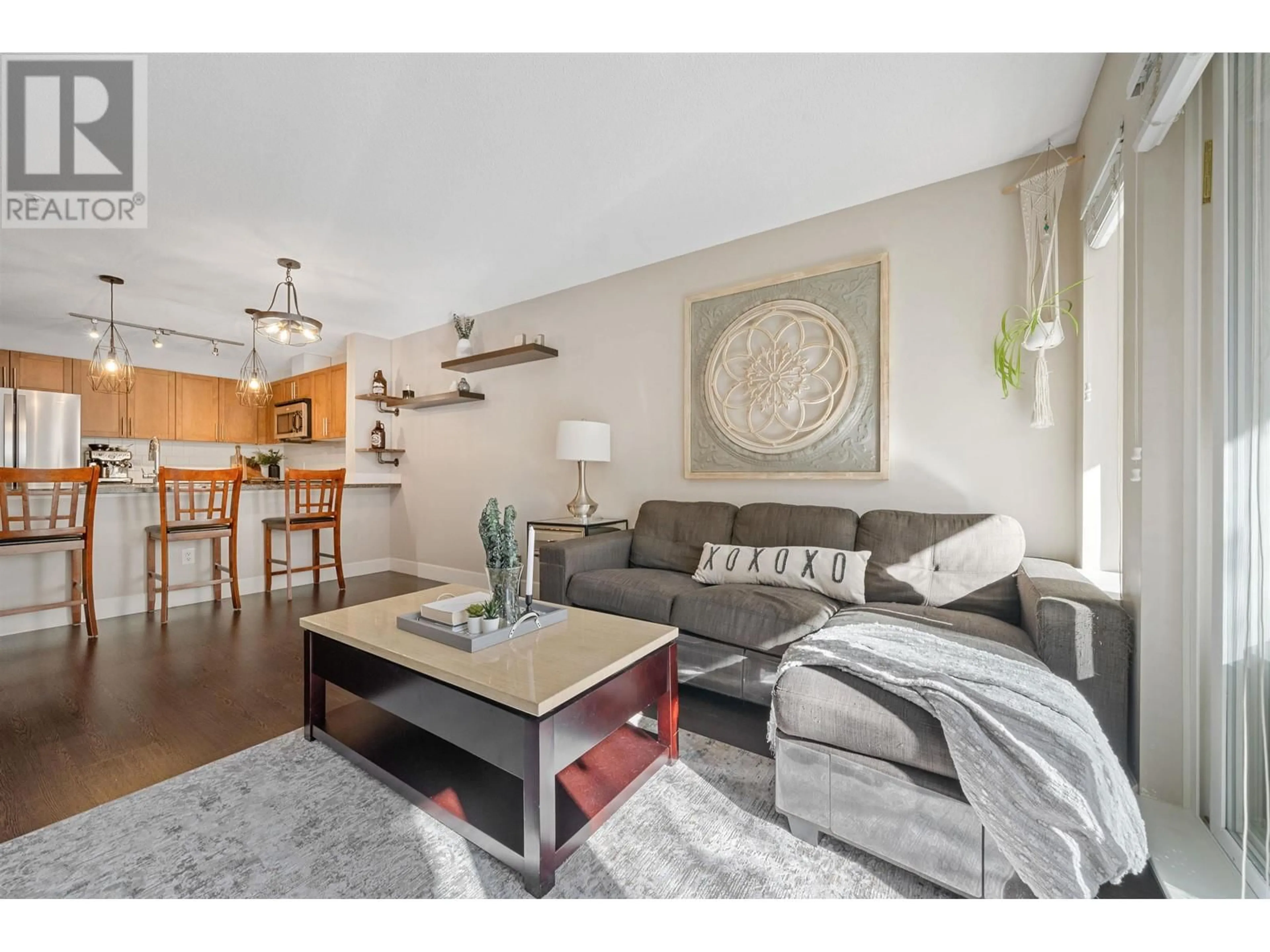 Living room with furniture, wood/laminate floor for 213 - 12283 224 STREET, Maple Ridge British Columbia V2X8Z3