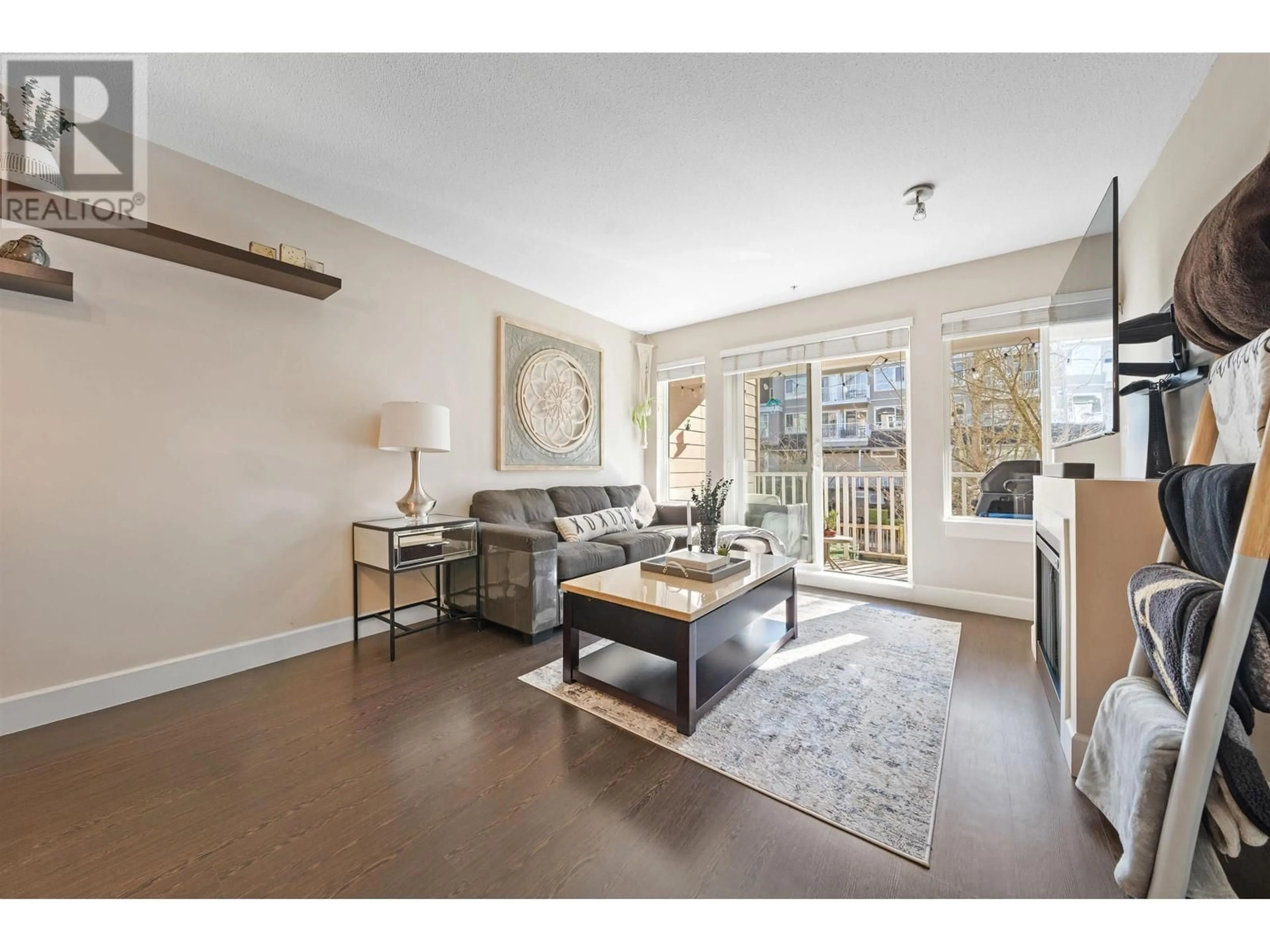 Living room with furniture, wood/laminate floor for 213 - 12283 224 STREET, Maple Ridge British Columbia V2X8Z3