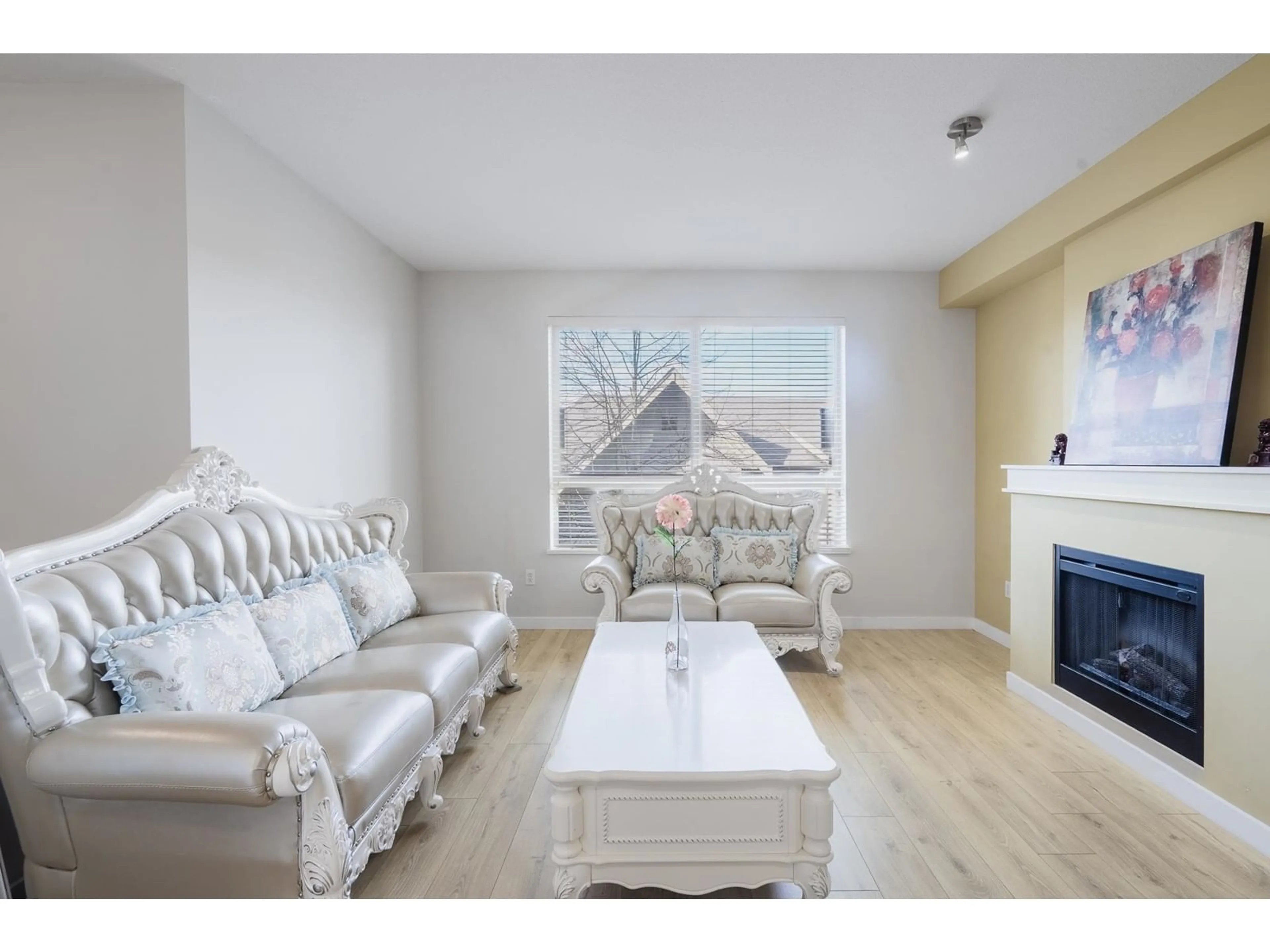 Living room with furniture, wood/laminate floor for 122 - 2738 158, Surrey British Columbia V3Z3K3