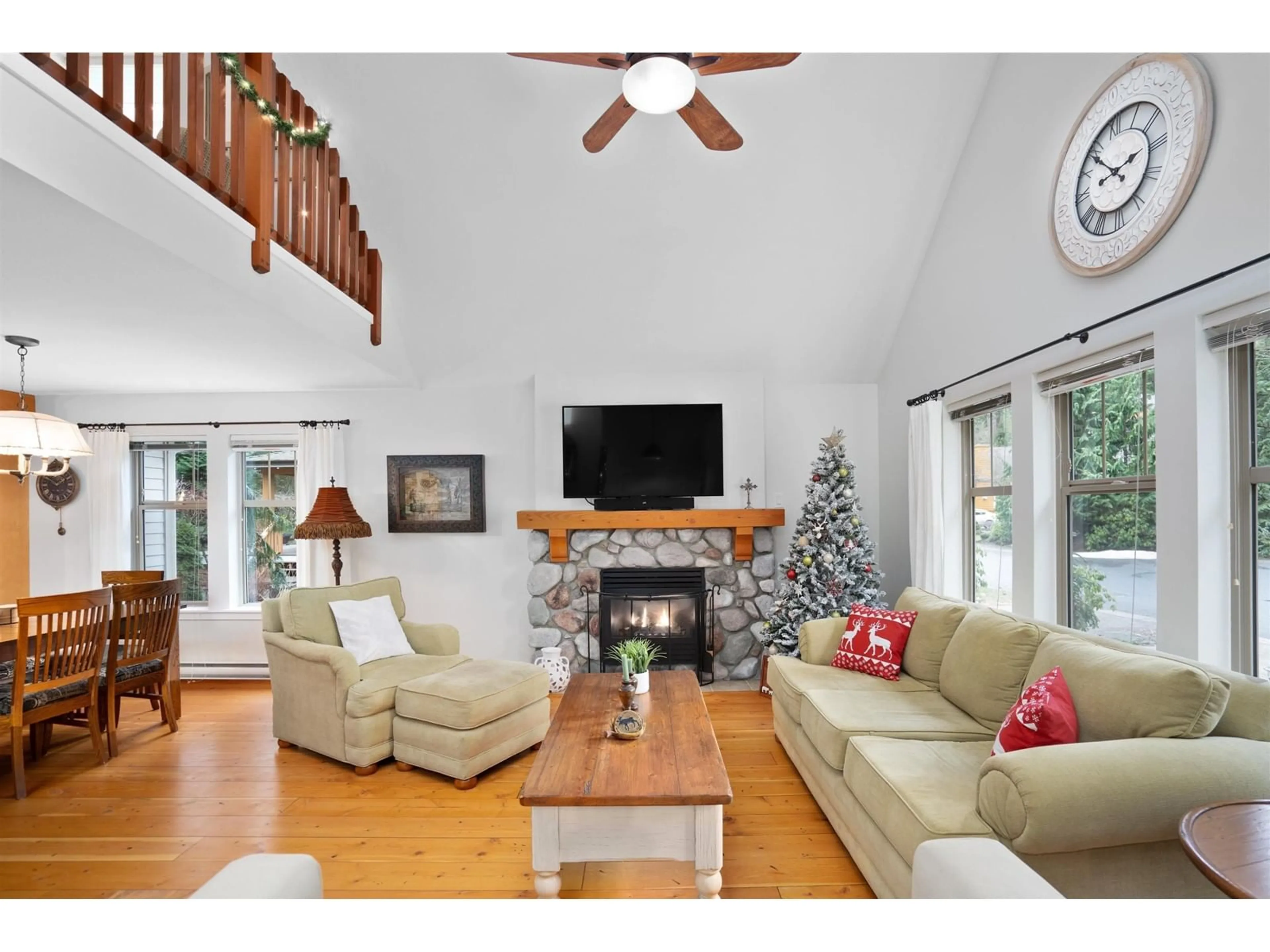 Living room with furniture, wood/laminate floor for 43548 RED HAWK PASS, Cultus Lake British Columbia V2R0E1