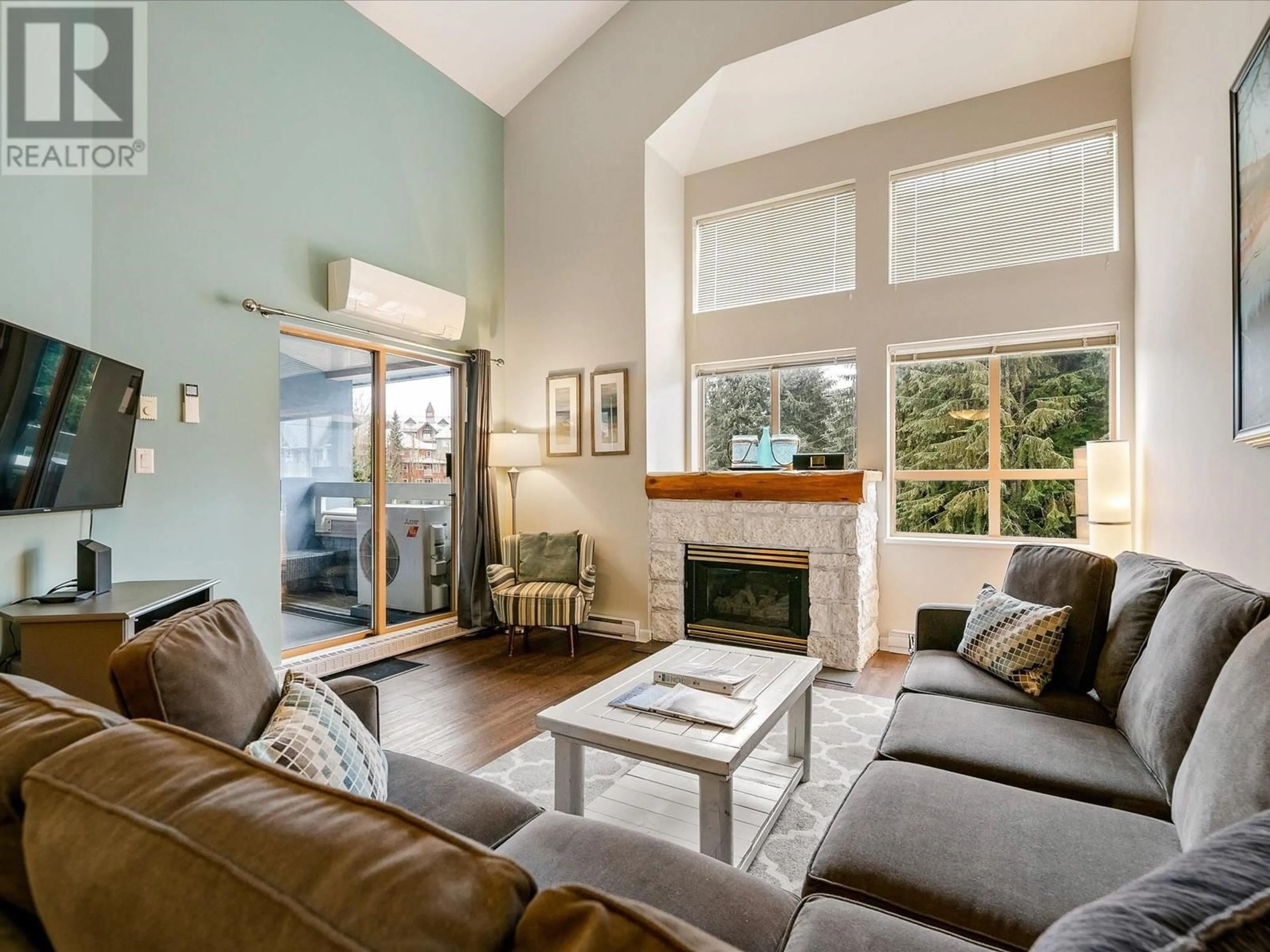 Living room with furniture, wood/laminate floor for 323 - 4338 MAIN STREET, Whistler British Columbia V8E1B4