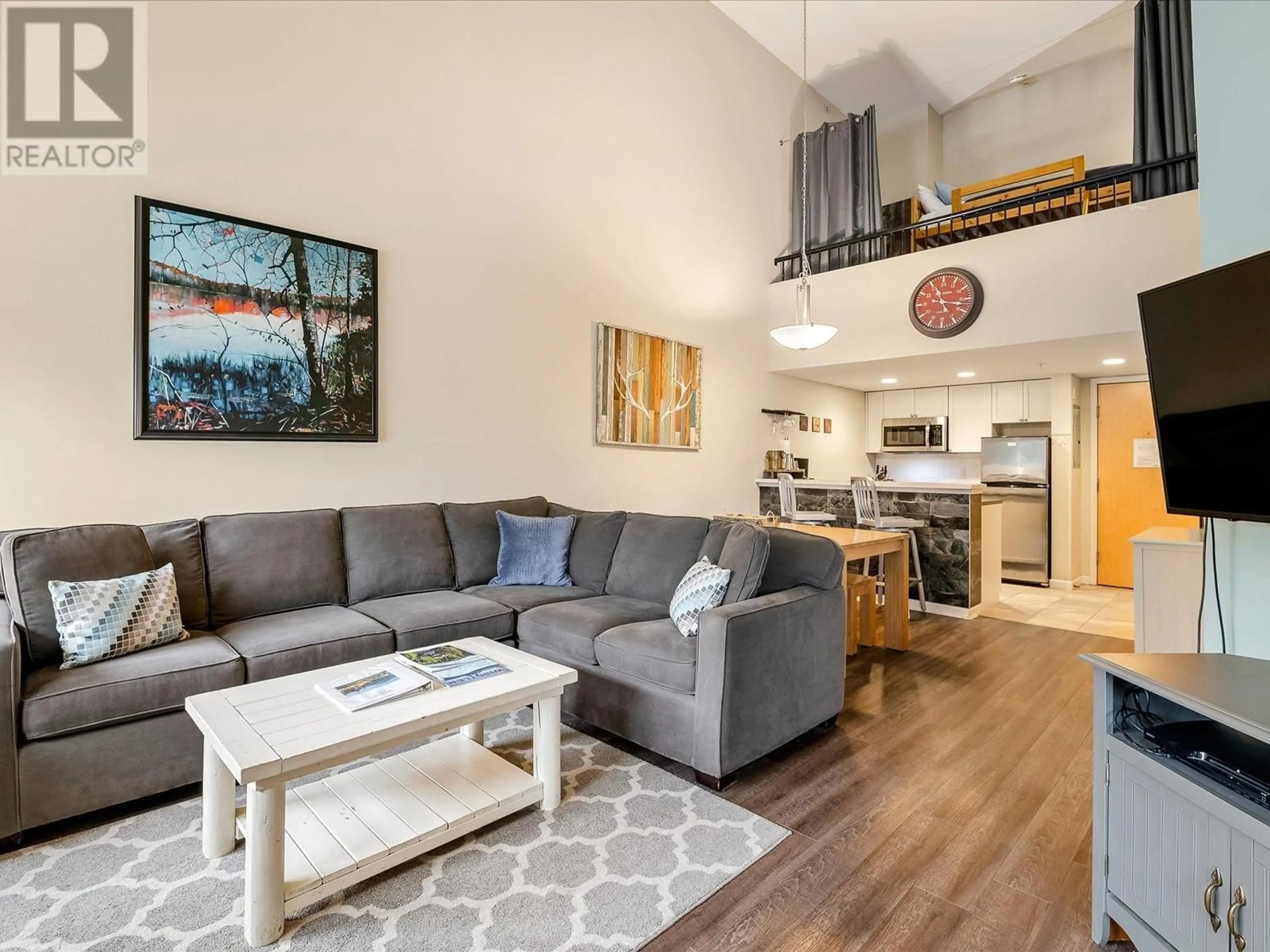 Living room with furniture, wood/laminate floor for 323 - 4338 MAIN STREET, Whistler British Columbia V8E1B4