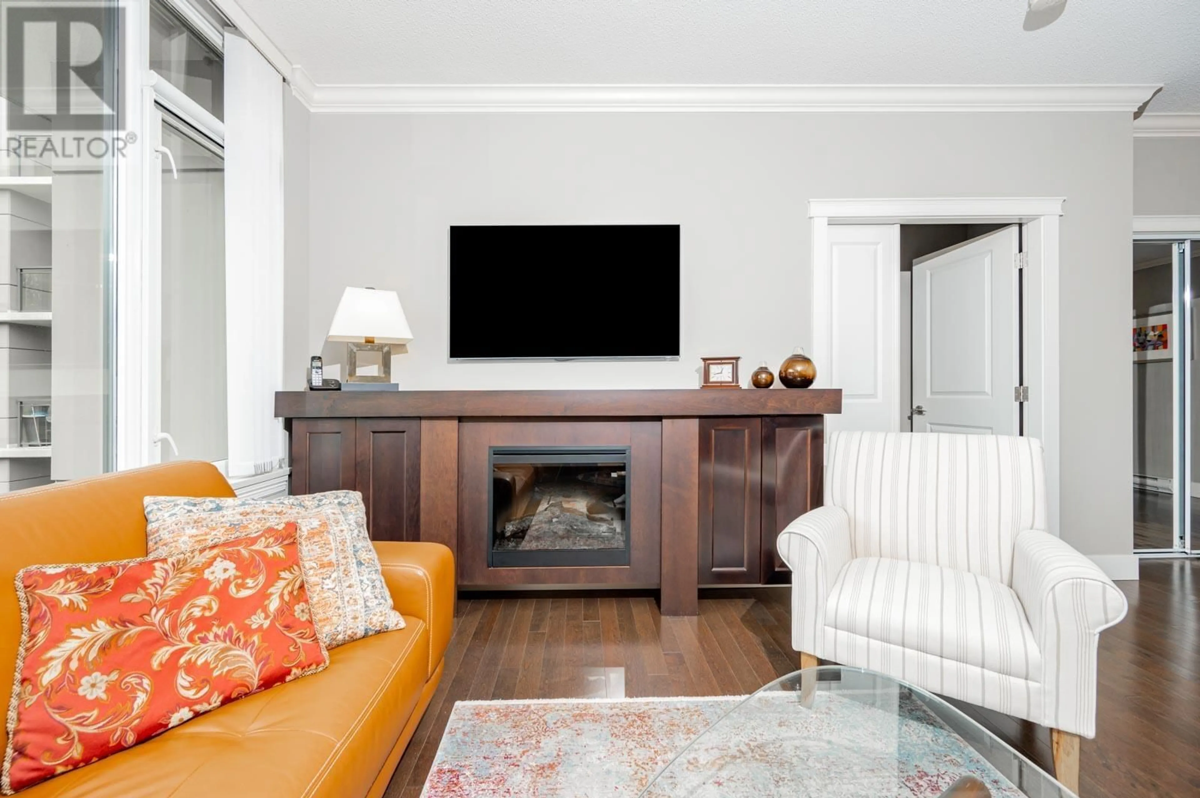 Living room with furniture, wood/laminate floor for 713 - 1415 PARKWAY BOULEVARD, Coquitlam British Columbia V3E0C7