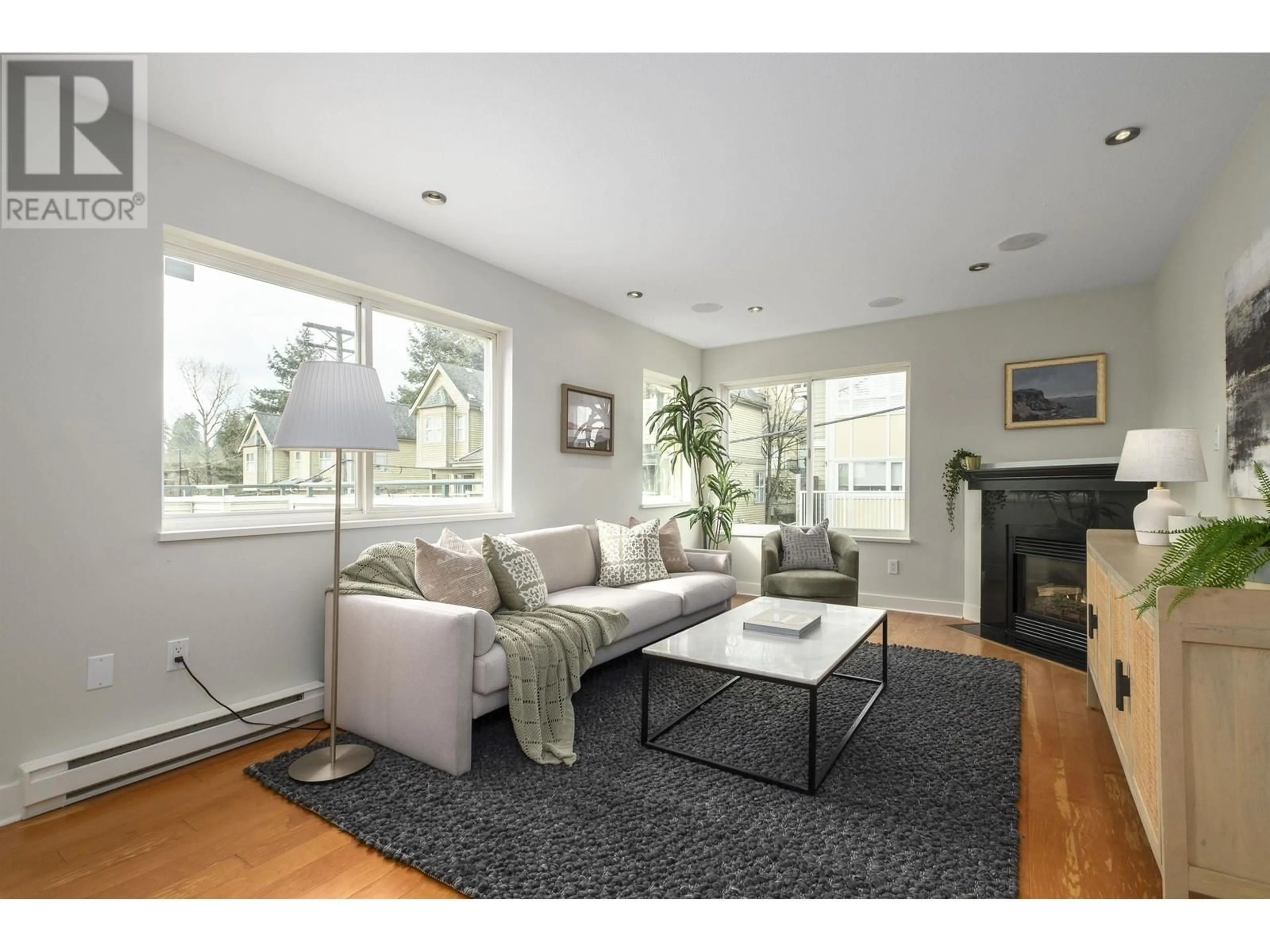 Living room with furniture, wood/laminate floor for 304 - 918 16TH STREET, North Vancouver British Columbia V7P1R3