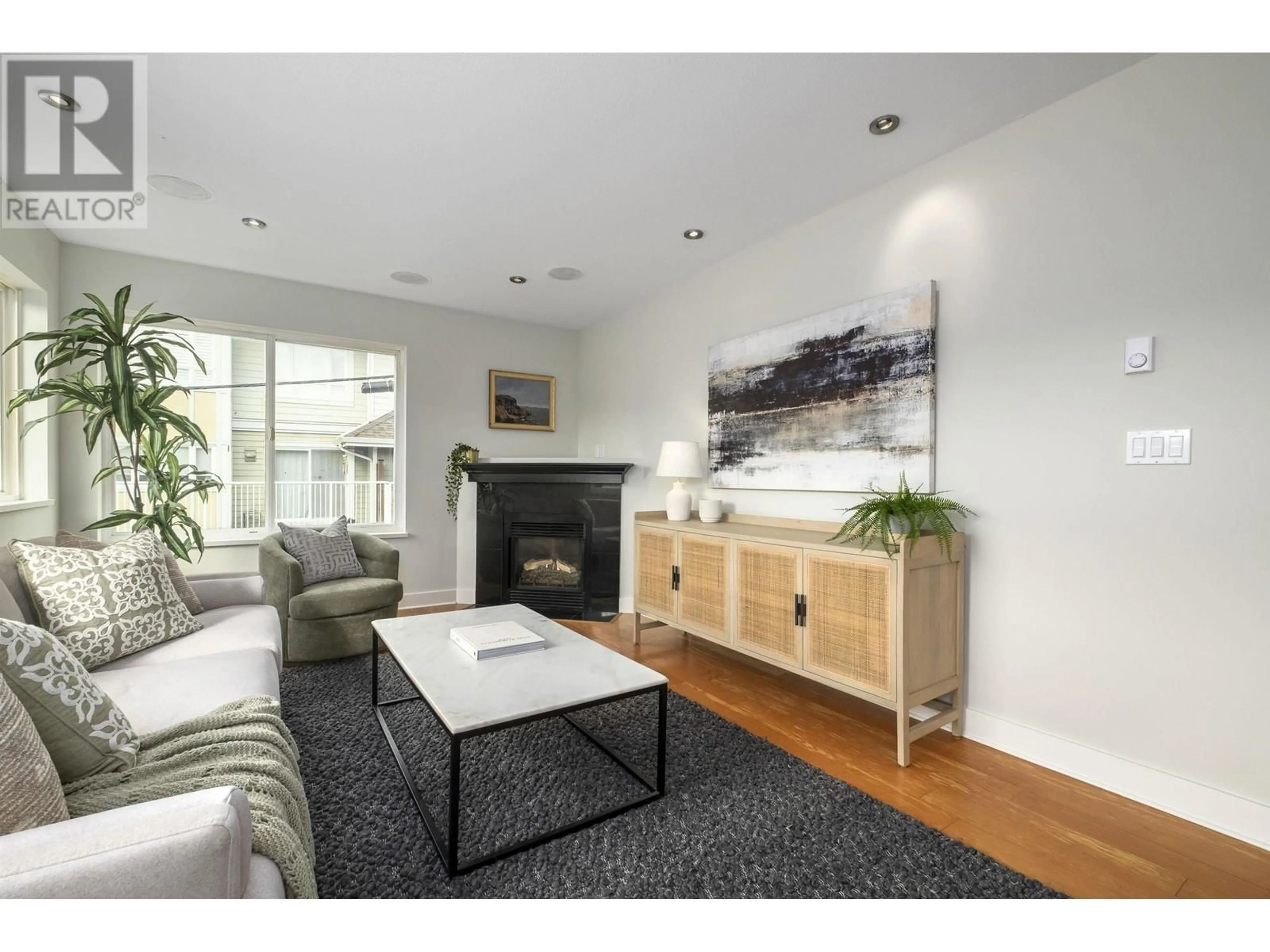 Living room with furniture, wood/laminate floor for 304 - 918 16TH STREET, North Vancouver British Columbia V7P1R3