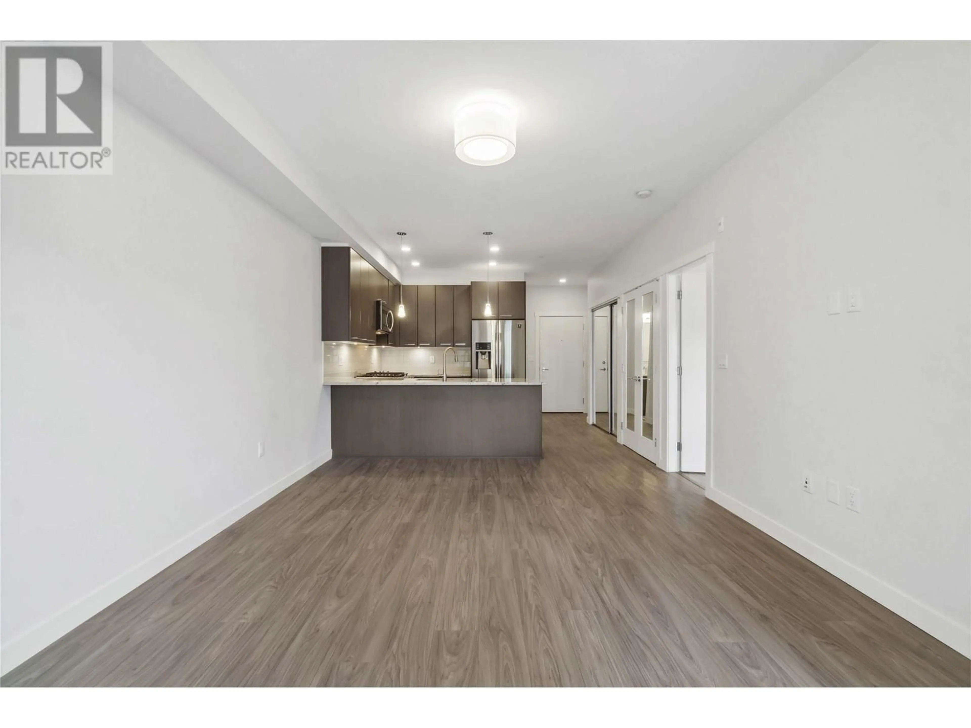 Open concept kitchen, wood/laminate floor for 208 - 2356 WELCHER AVENUE, Port Coquitlam British Columbia V3C1X6