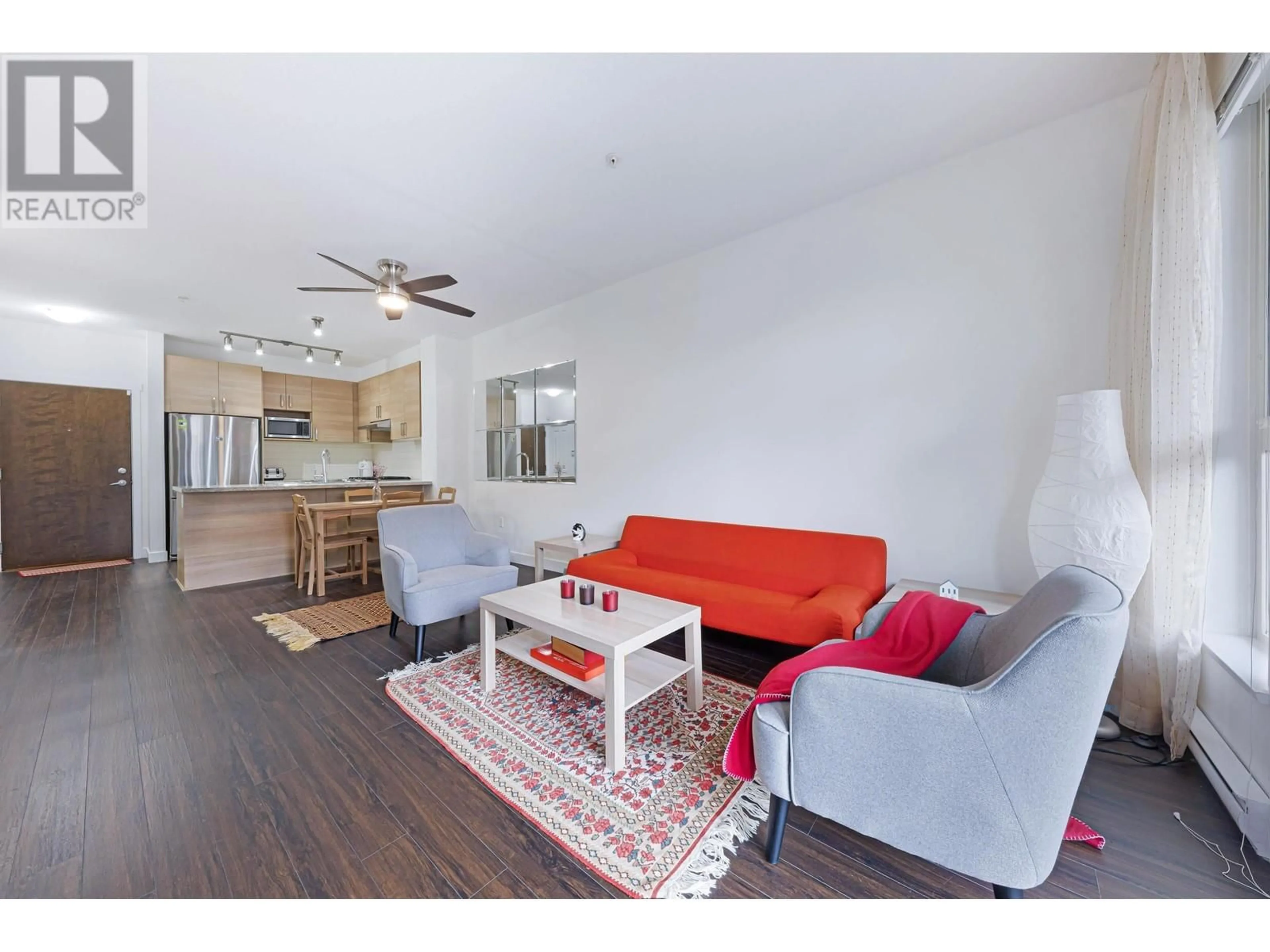 Living room with furniture, wood/laminate floor for 212 - 1150 KENSAL PLACE, Coquitlam British Columbia V3B0H4