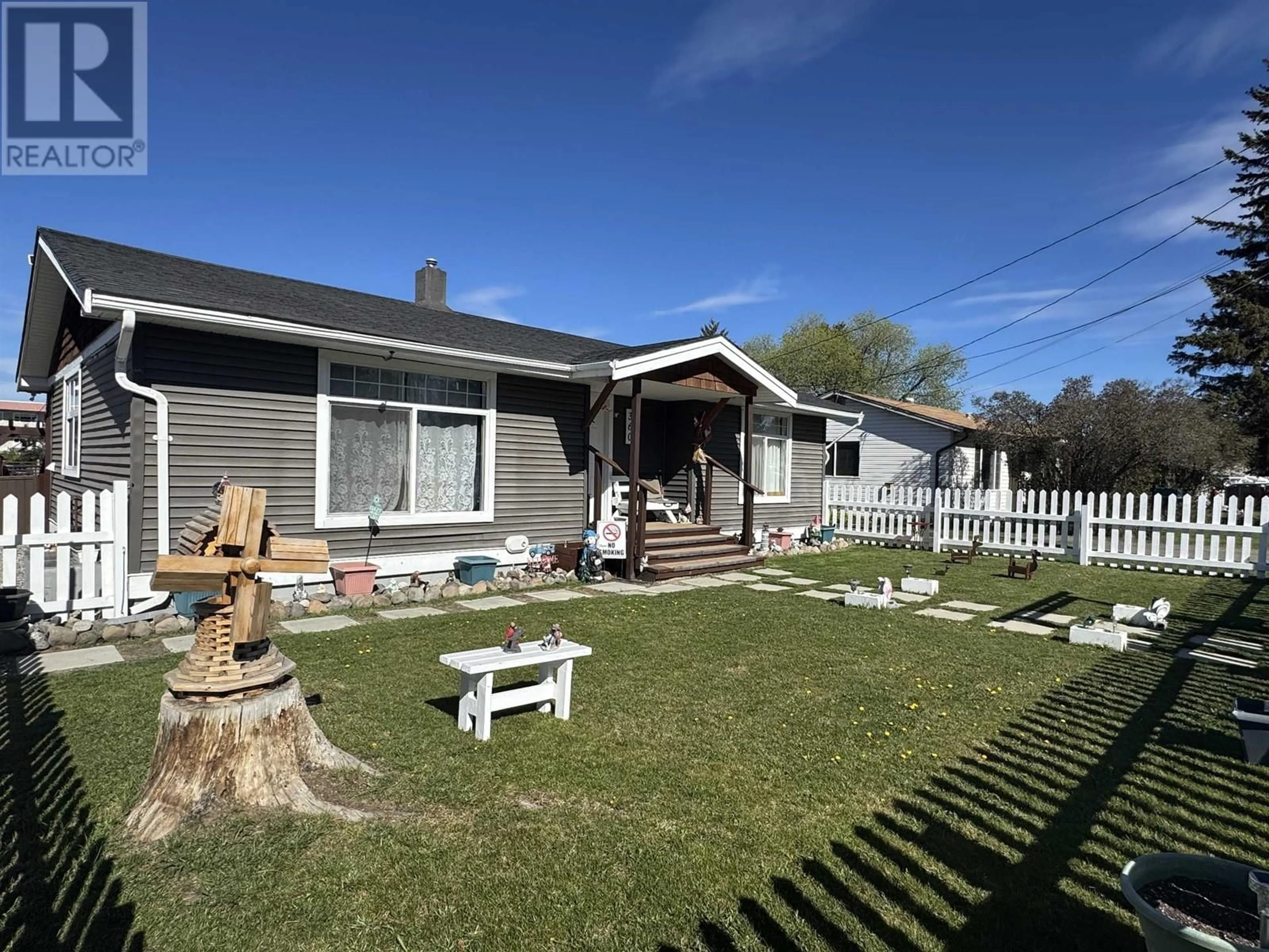 A pic from outside/outdoor area/front of a property/back of a property/a pic from drone, unknown for 360 CEDAR AVENUE, 100 Mile House British Columbia V0K2E0