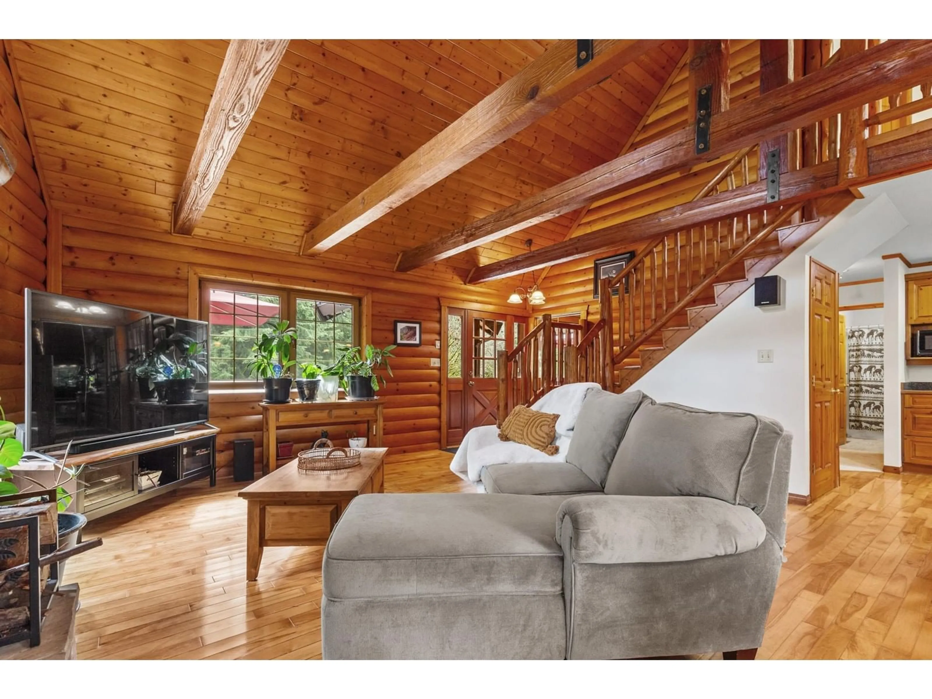 Living room with furniture, wood/laminate floor for 12200 POWELL, Mission British Columbia V4S1C1
