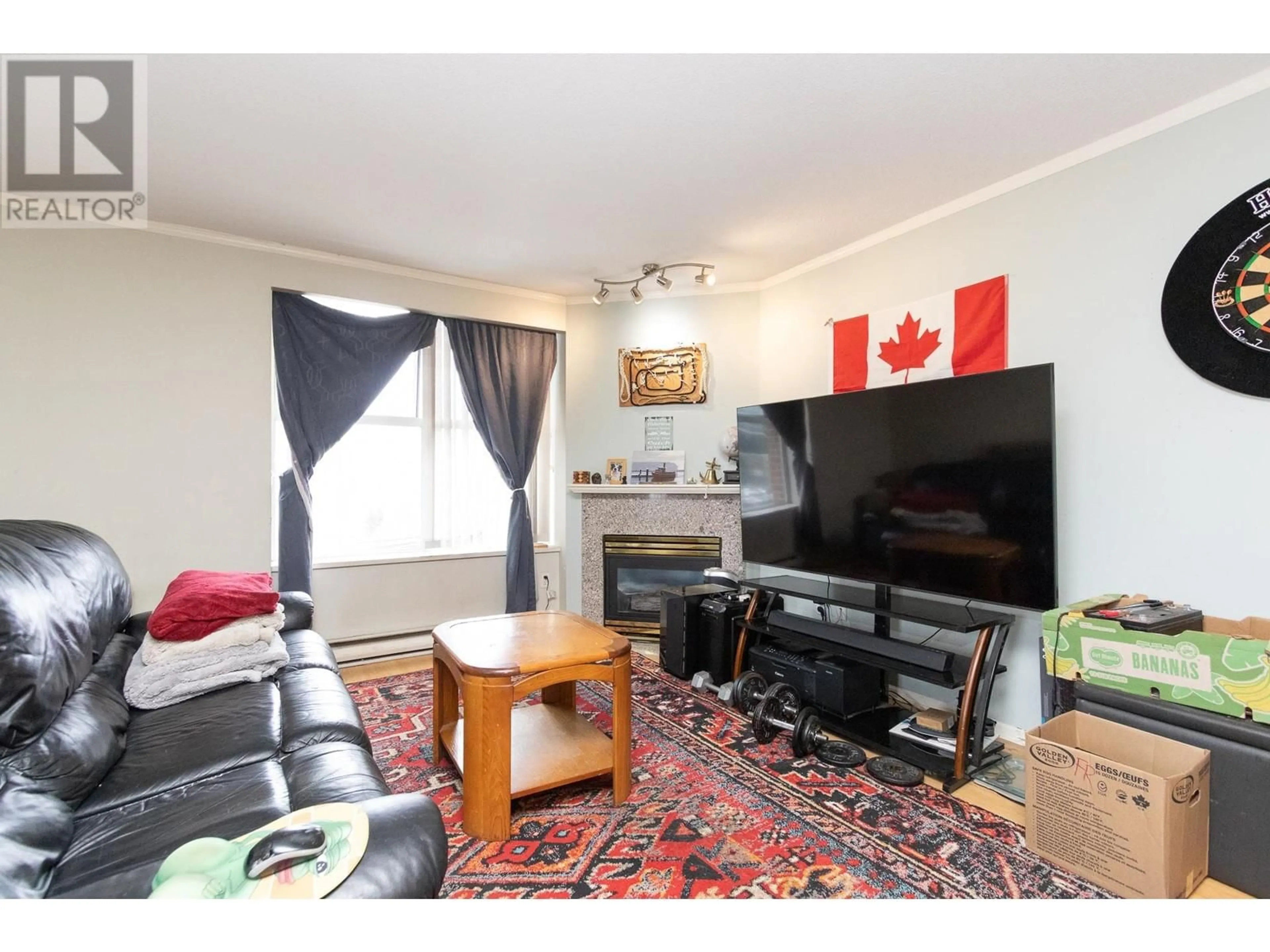 Living room with furniture, wood/laminate floor for 605 - 1255 MAIN STREET, Vancouver British Columbia V6A4G5
