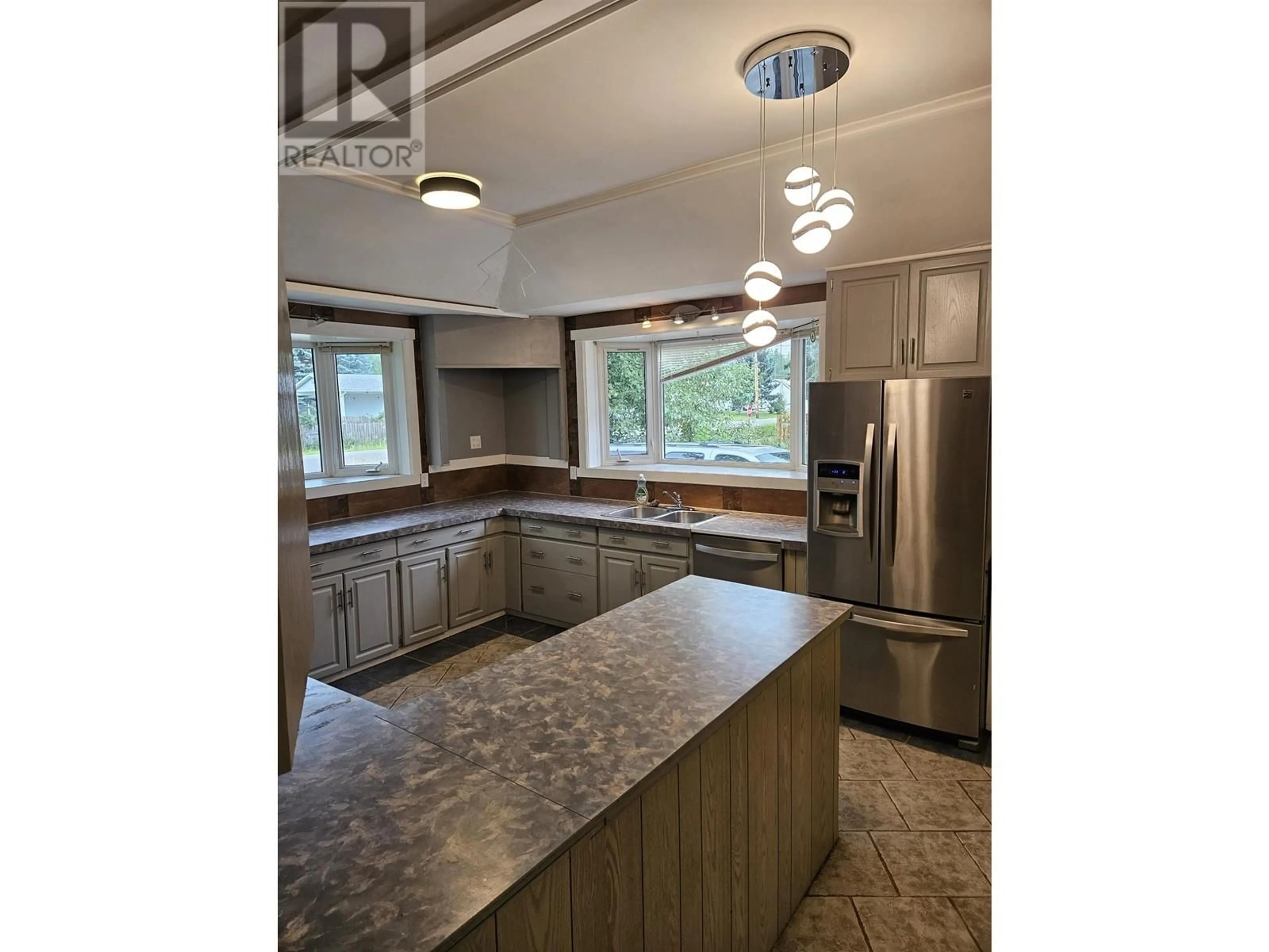 Standard kitchen, ceramic/tile floor for 7064 ADAM DRIVE, Prince George British Columbia V2K2M7