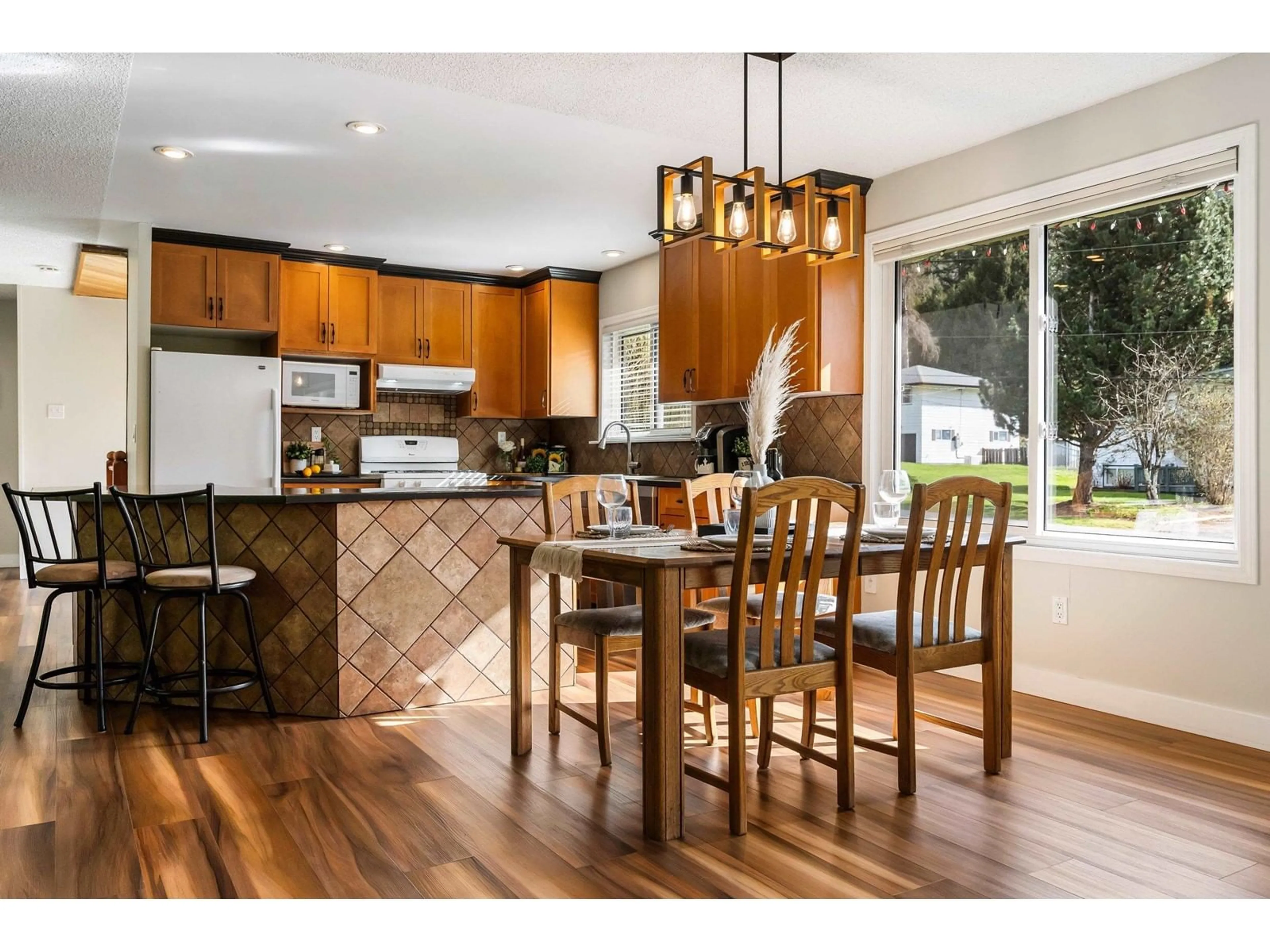 Open concept kitchen, wood/laminate floor for 4563 LYARDON ROAD, Chilliwack British Columbia V2R4N1