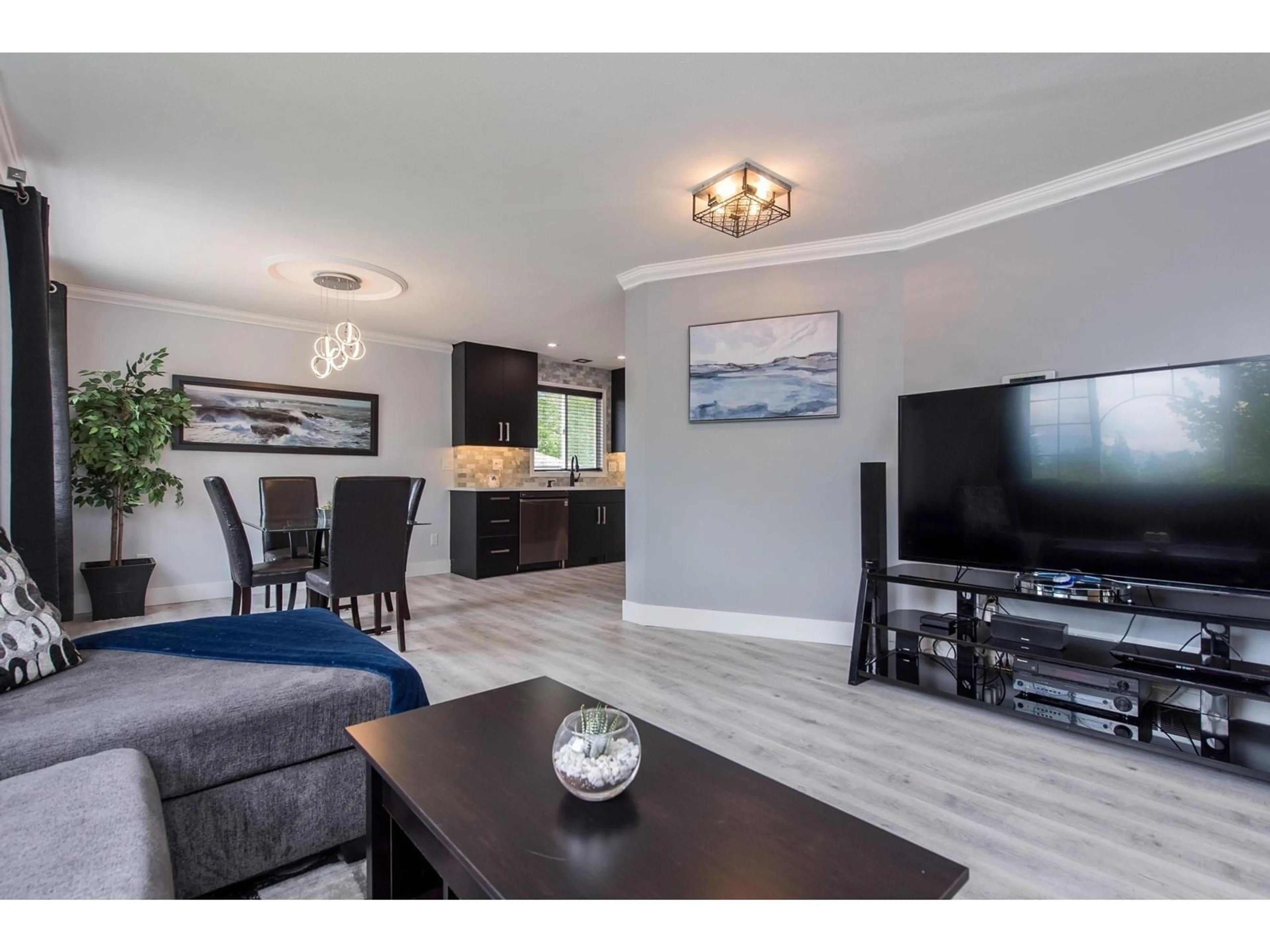 Living room with furniture, wood/laminate floor for 5628 THORNHILL STREET, Chilliwack British Columbia V2R3Y7