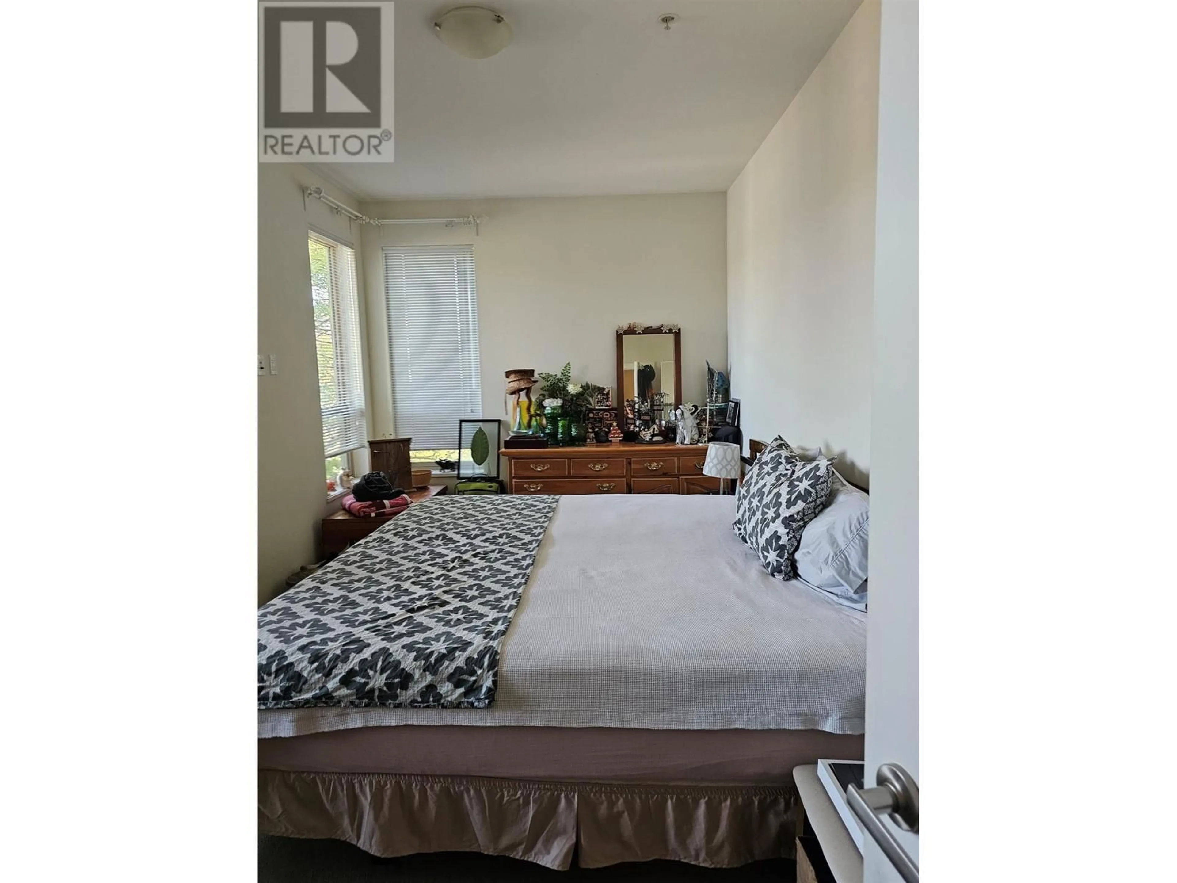 Bedroom with bed, wood/laminate floor for 301 - 240 FRANCIS WAY, New Westminster British Columbia V3L0E5