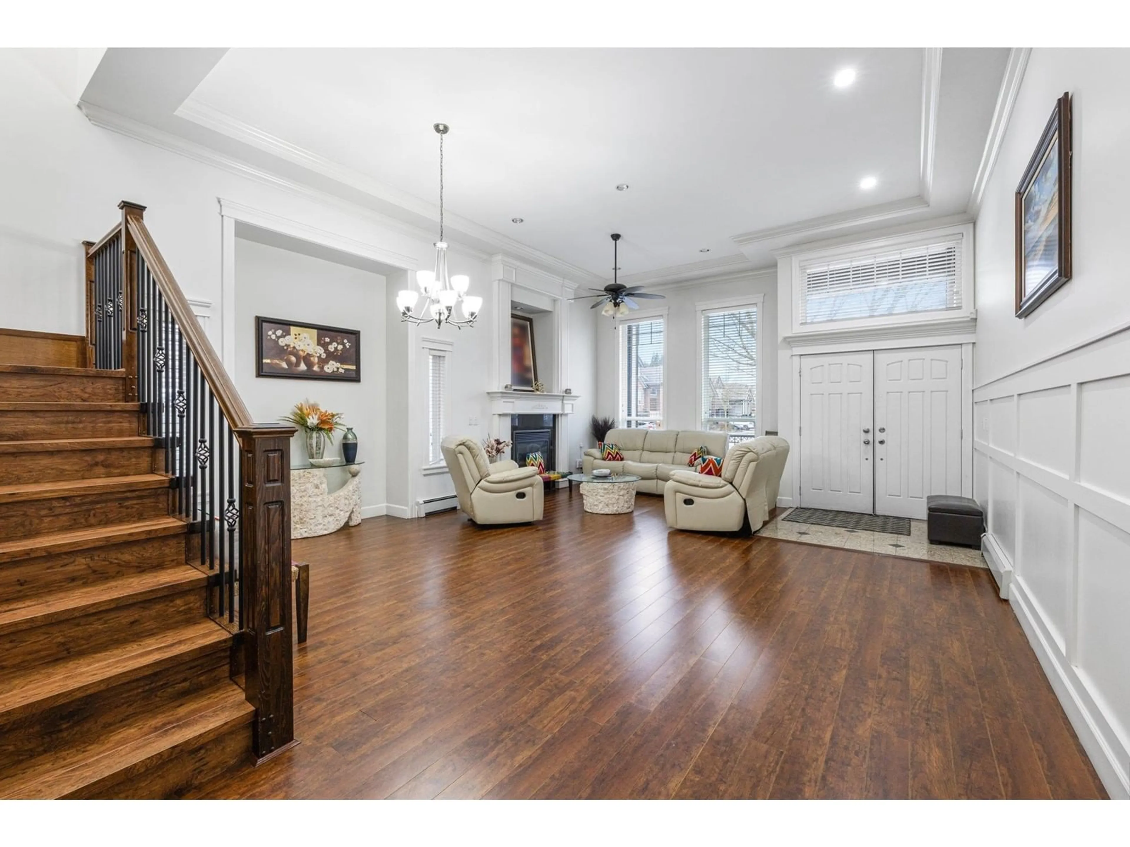 Living room with furniture, wood/laminate floor for 6250 142B, Surrey British Columbia V3X0B7