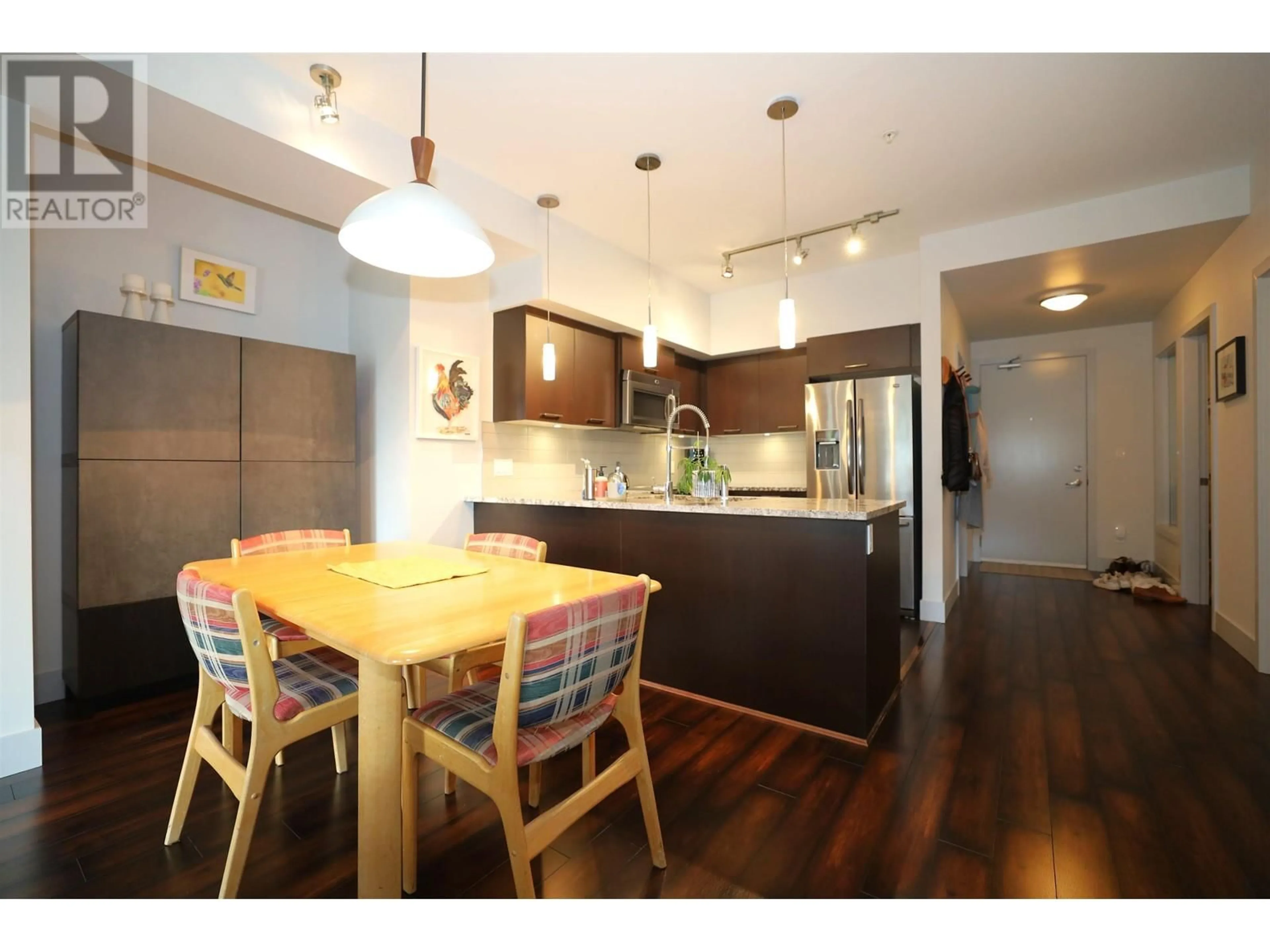 Open concept kitchen, wood/laminate floor for 209 - 5682 WHARF AVENUE, Sechelt British Columbia V7Z0J3