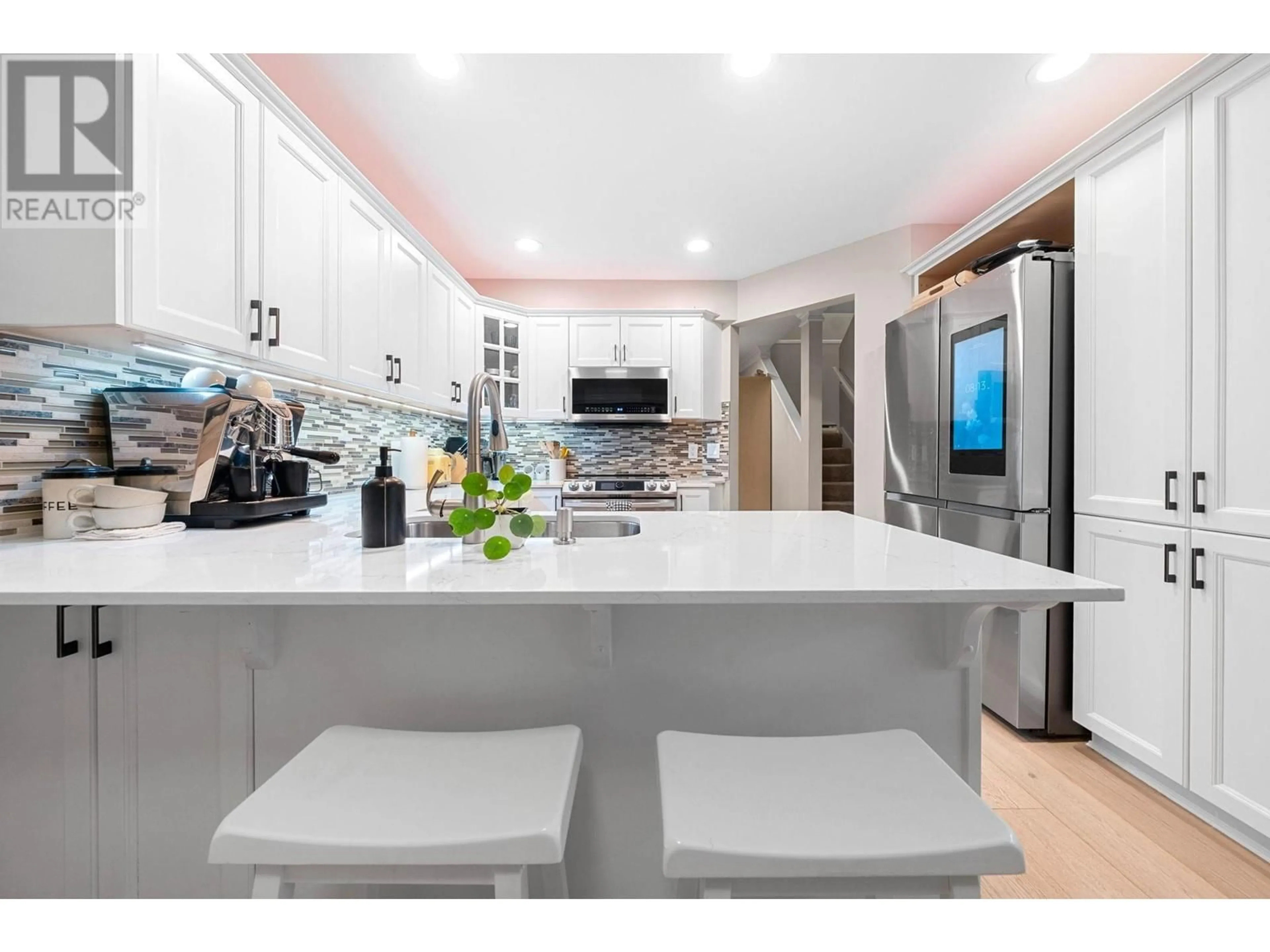 Open concept kitchen, ceramic/tile floor for 206 - 288 6TH STREET, North Vancouver British Columbia V7L1P5