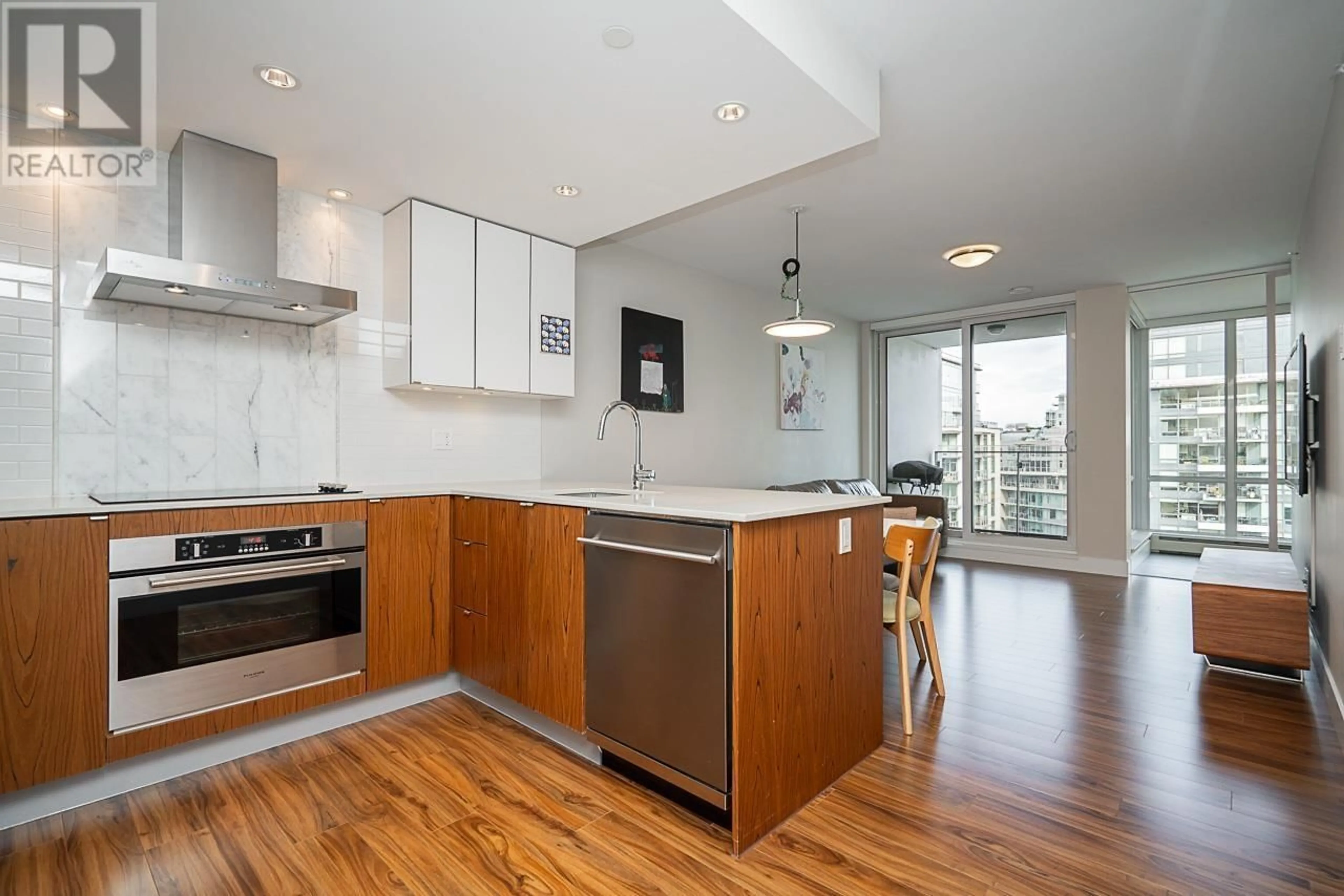 Open concept kitchen, wood/laminate floor for 1205 - 159 2ND AVENUE, Vancouver British Columbia V5Y0L8
