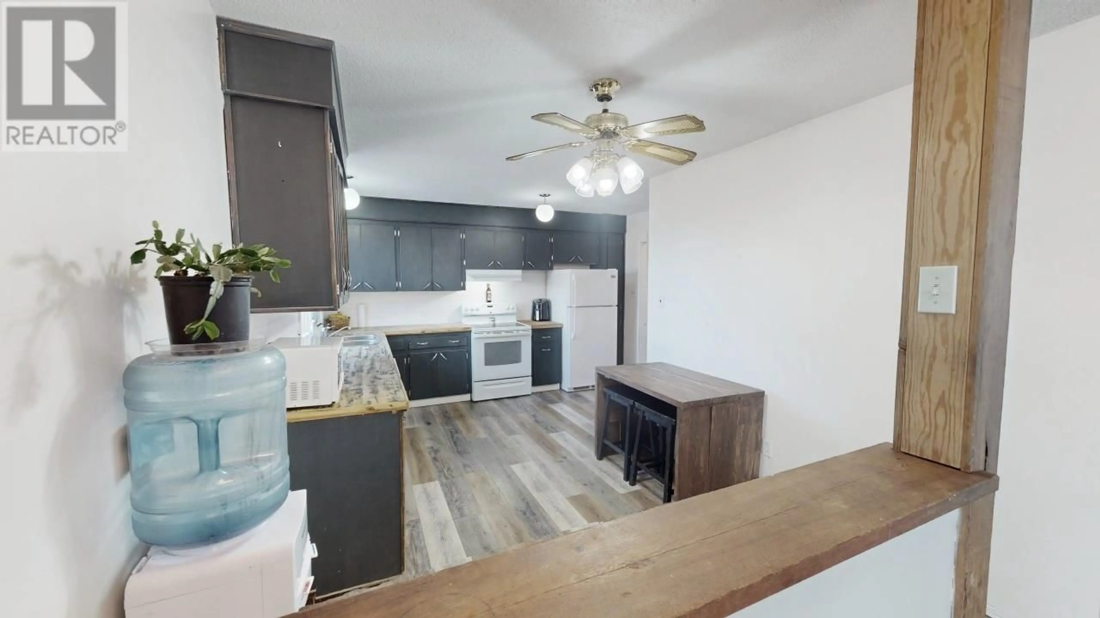 Open concept kitchen, wood/laminate floor for 6365 MARIGOLD AVENUE, Fort St. John British Columbia V1J8B6