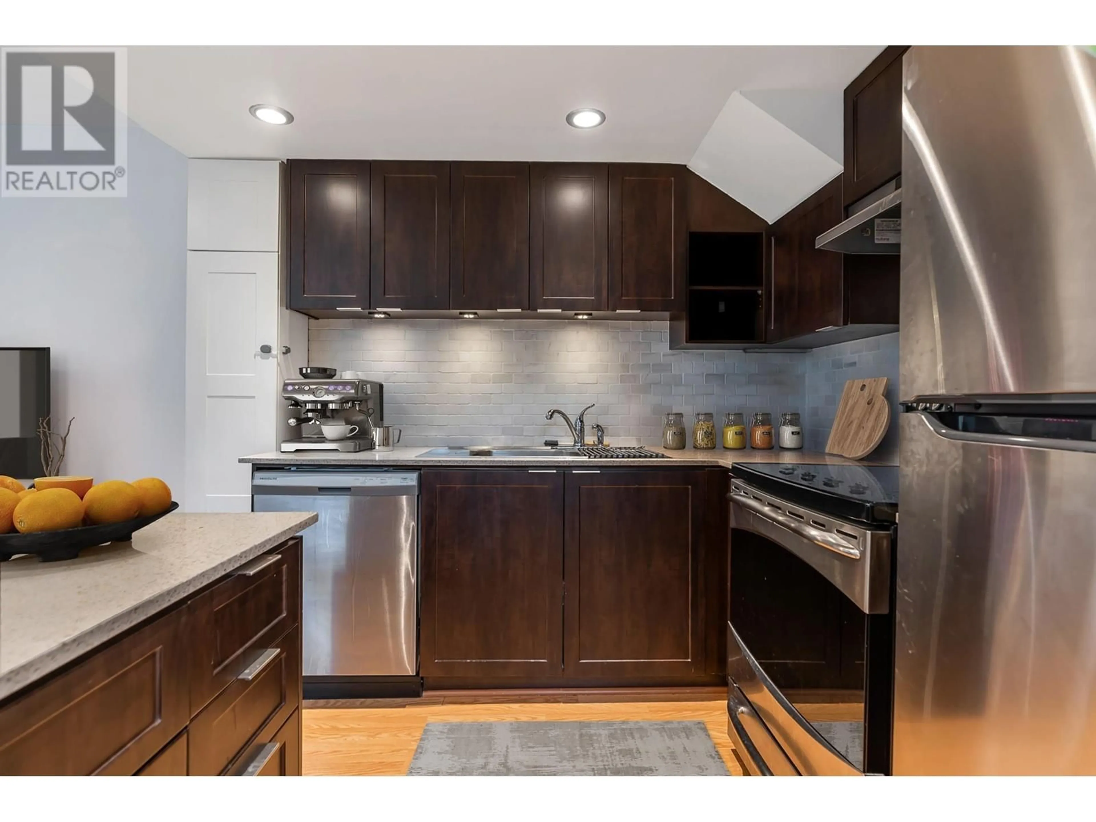 Open concept kitchen, wood/laminate floor for 9234 UNIVERSITY CRESCENT, Burnaby British Columbia V5A0A3