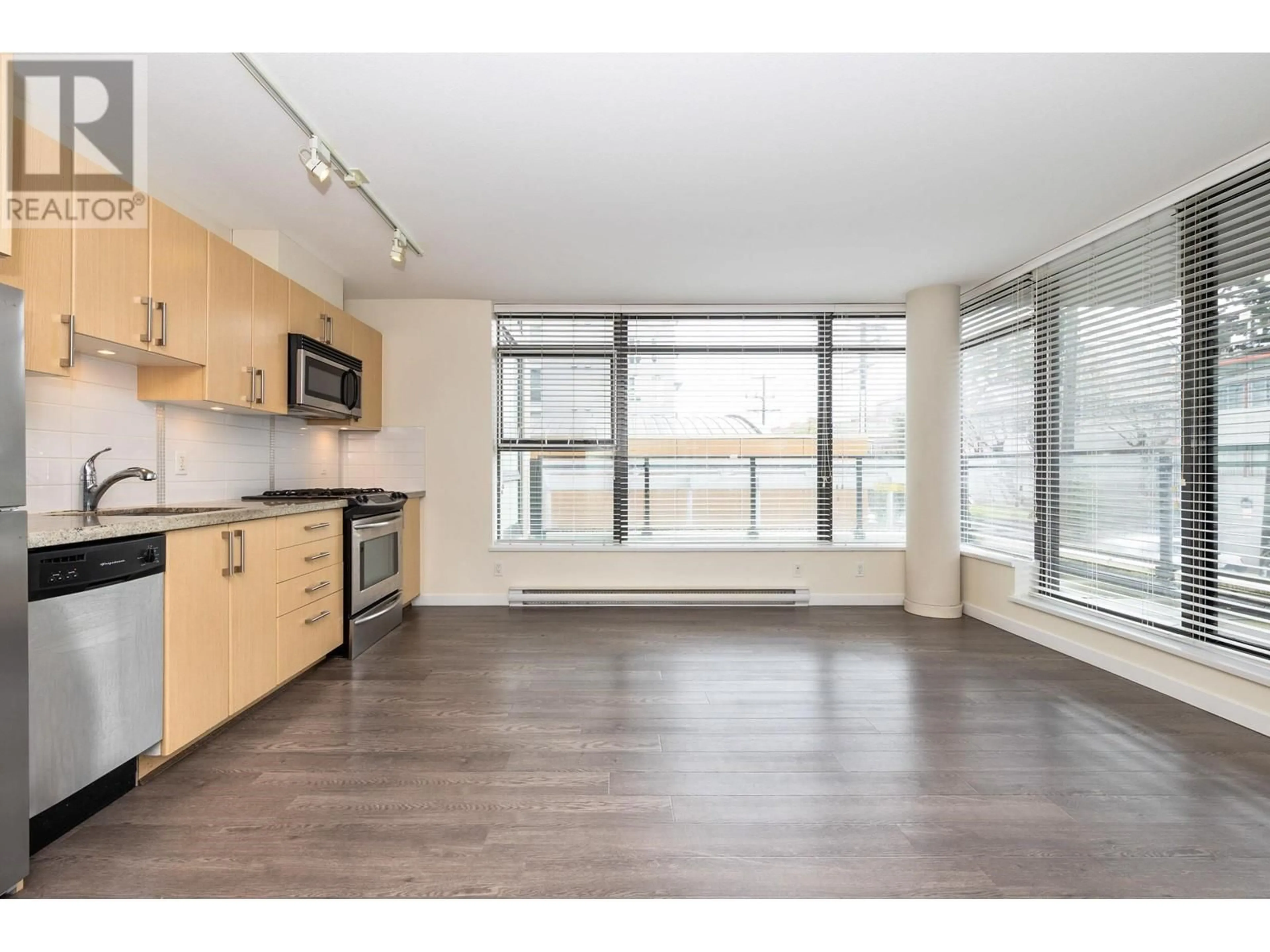 Open concept kitchen, wood/laminate floor for 302 - 1068 BROADWAY, Vancouver British Columbia V6H0A7