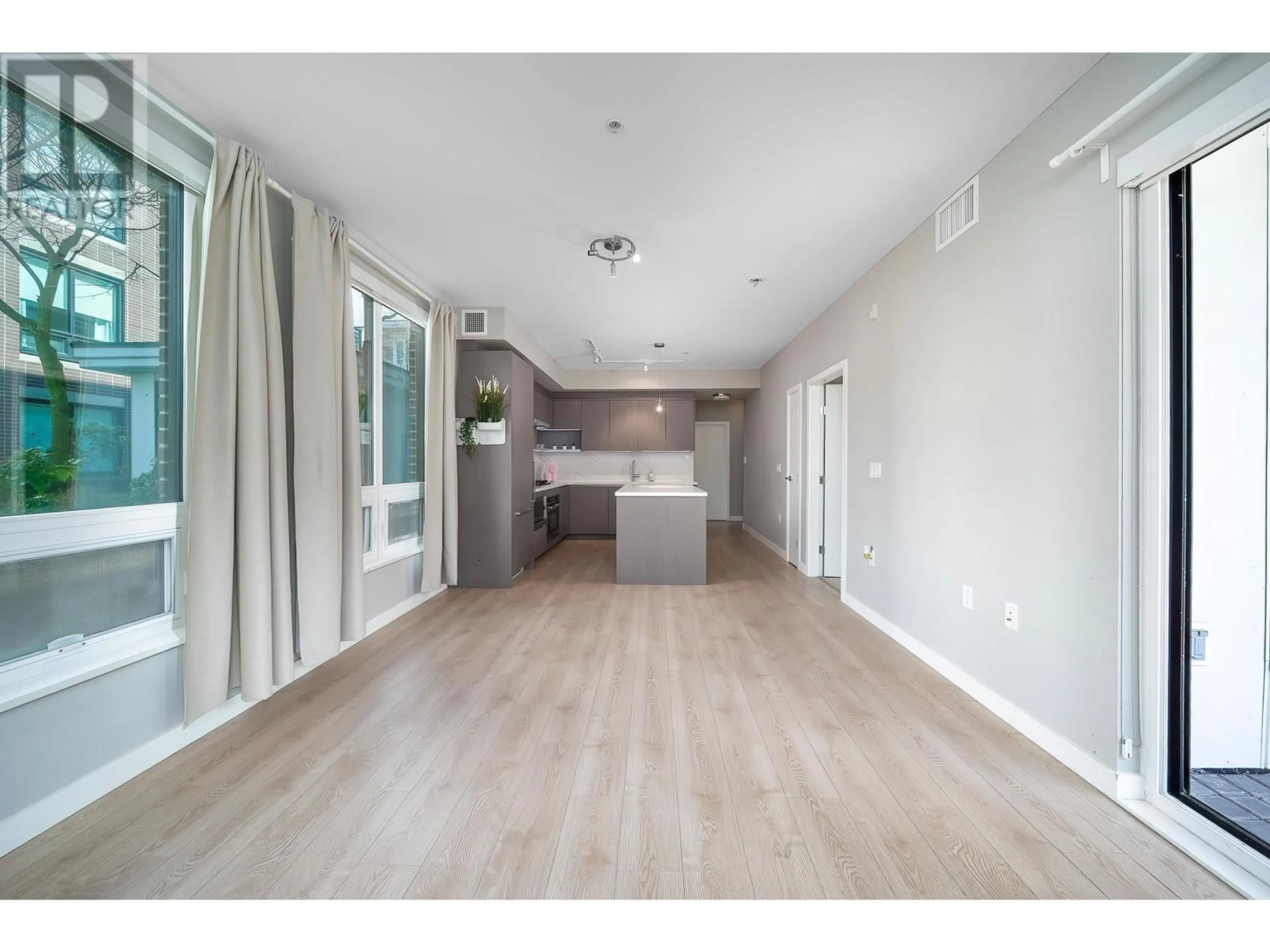 Open concept kitchen, wood/laminate floor for 125 - 9333 TOMICKI AVENUE, Richmond British Columbia V6X0L4