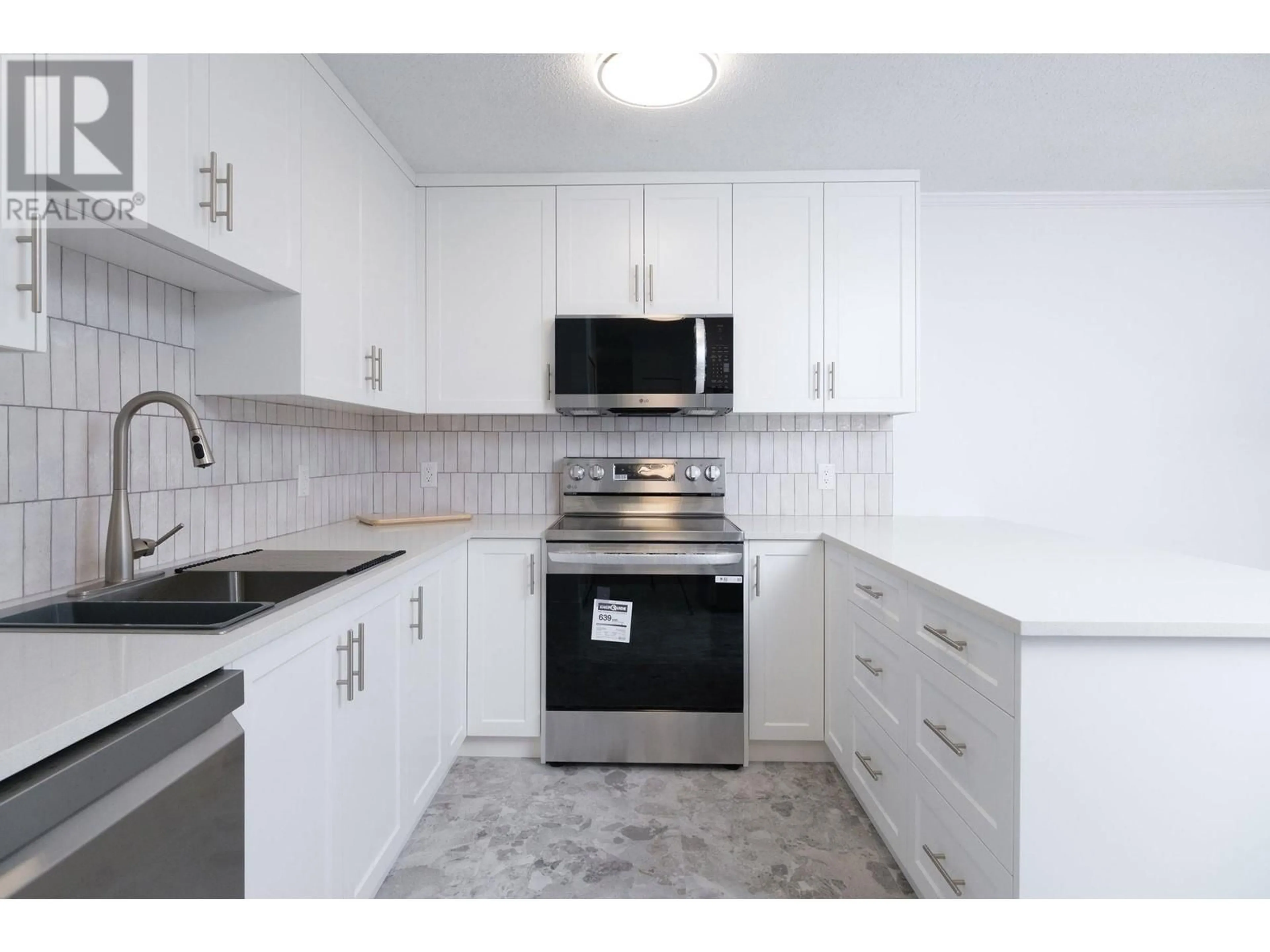 Living room with furniture, wood/laminate floor for 2401 - 3970 CARRIGAN COURT, Burnaby British Columbia V3N4S5