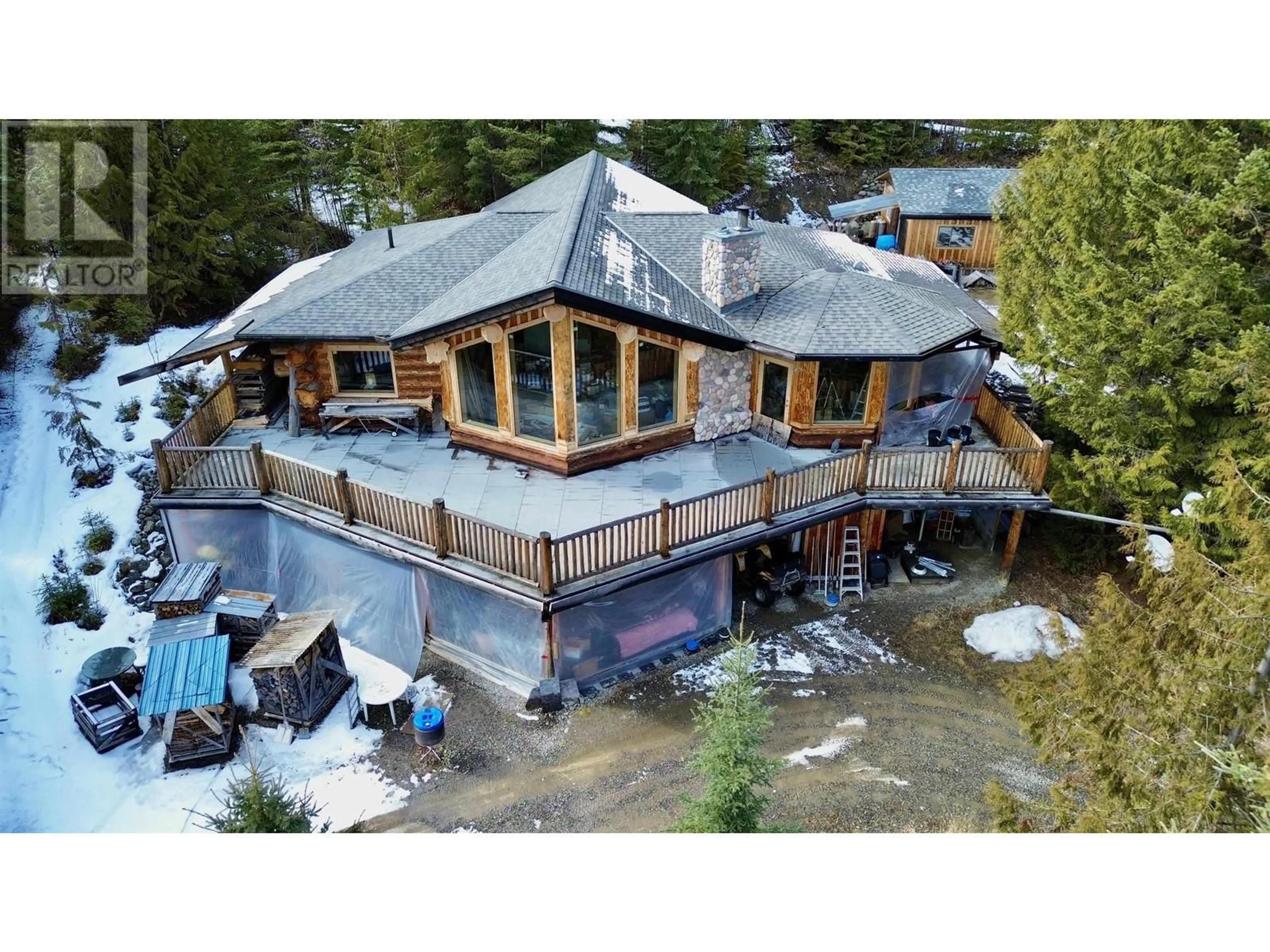 A pic from outside/outdoor area/front of a property/back of a property/a pic from drone, building for 3561 CANIM-HENDRIX LAKE ROAD, 100 Mile House British Columbia V0K1L0