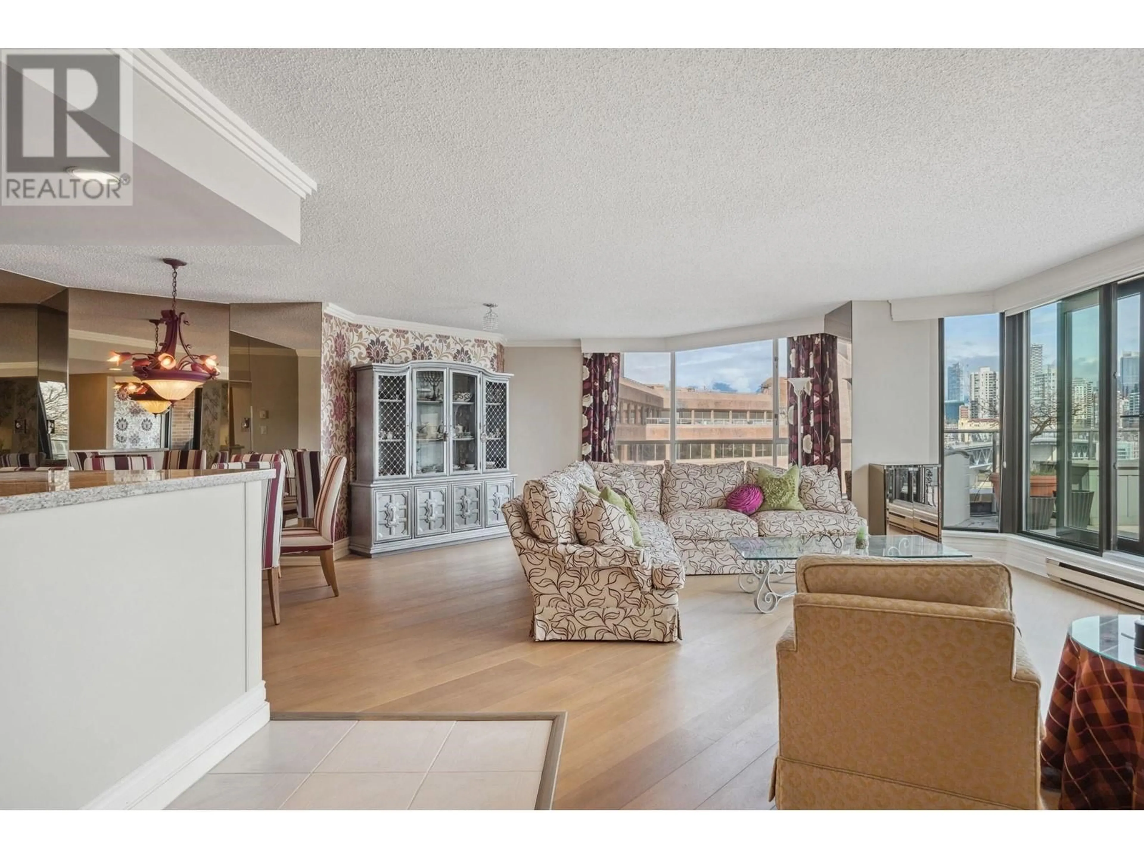 Living room with furniture, unknown for 1009 - 1450 PENNYFARTHING DRIVE, Vancouver British Columbia V6J4X8