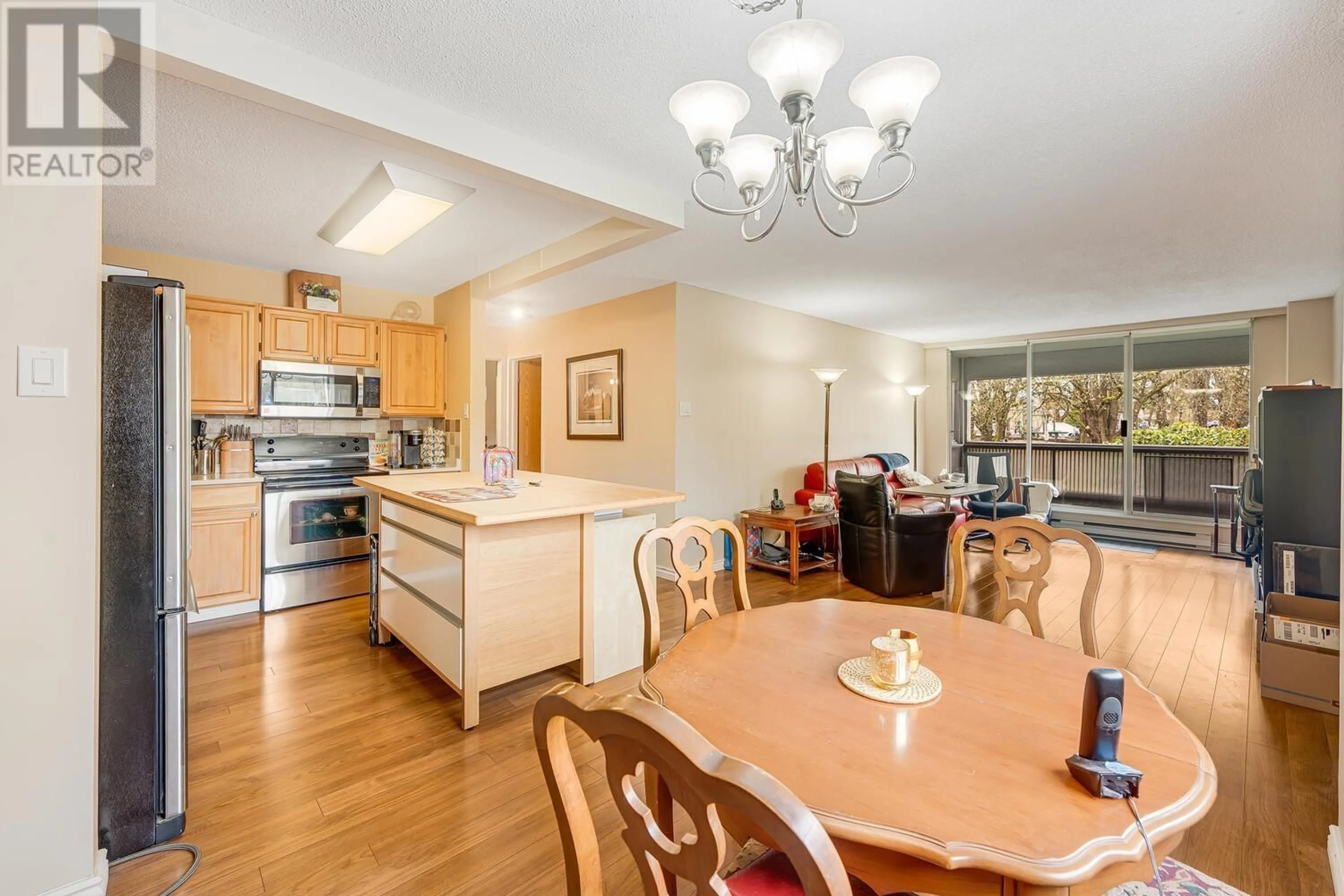 Open concept kitchen, wood/laminate floor for 202 - 550 EIGHTH STREET, New Westminster British Columbia V3M3R9