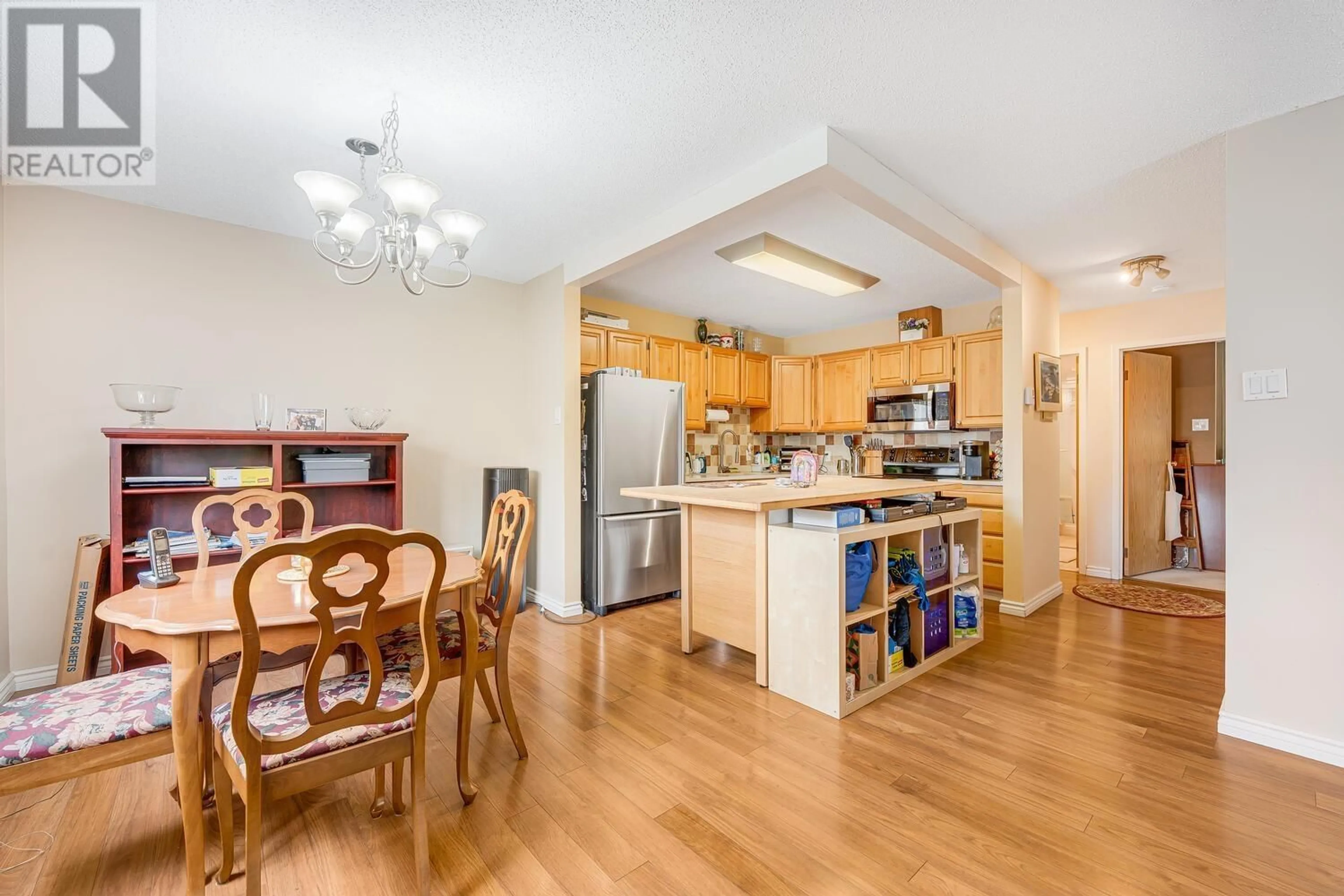 Open concept kitchen, wood/laminate floor for 202 - 550 EIGHTH STREET, New Westminster British Columbia V3M3R9