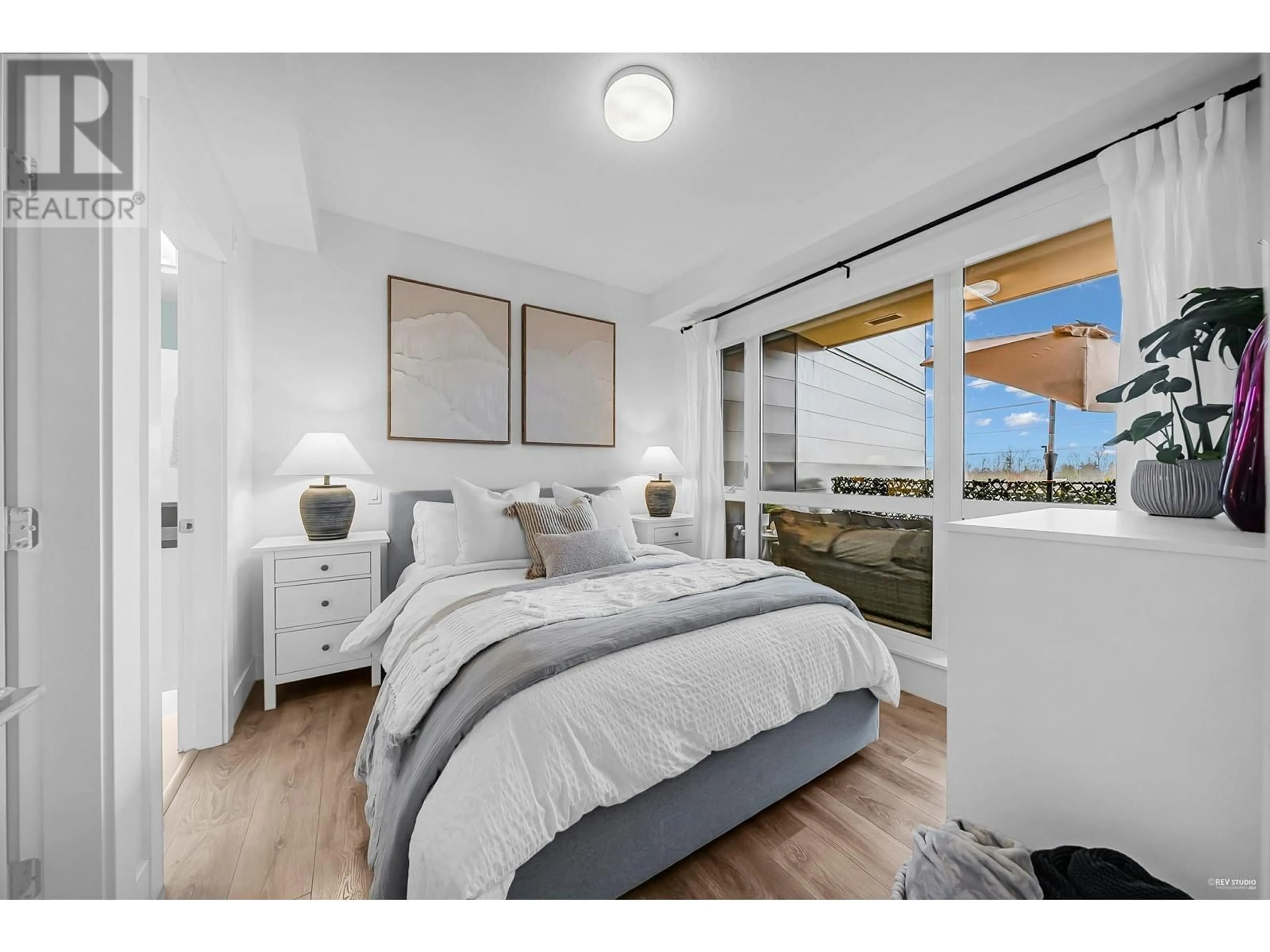 Bedroom with bed, wood/laminate floor for 505 - 8580 RIVER DISTRICT CROSSING, Vancouver British Columbia V5S0B9