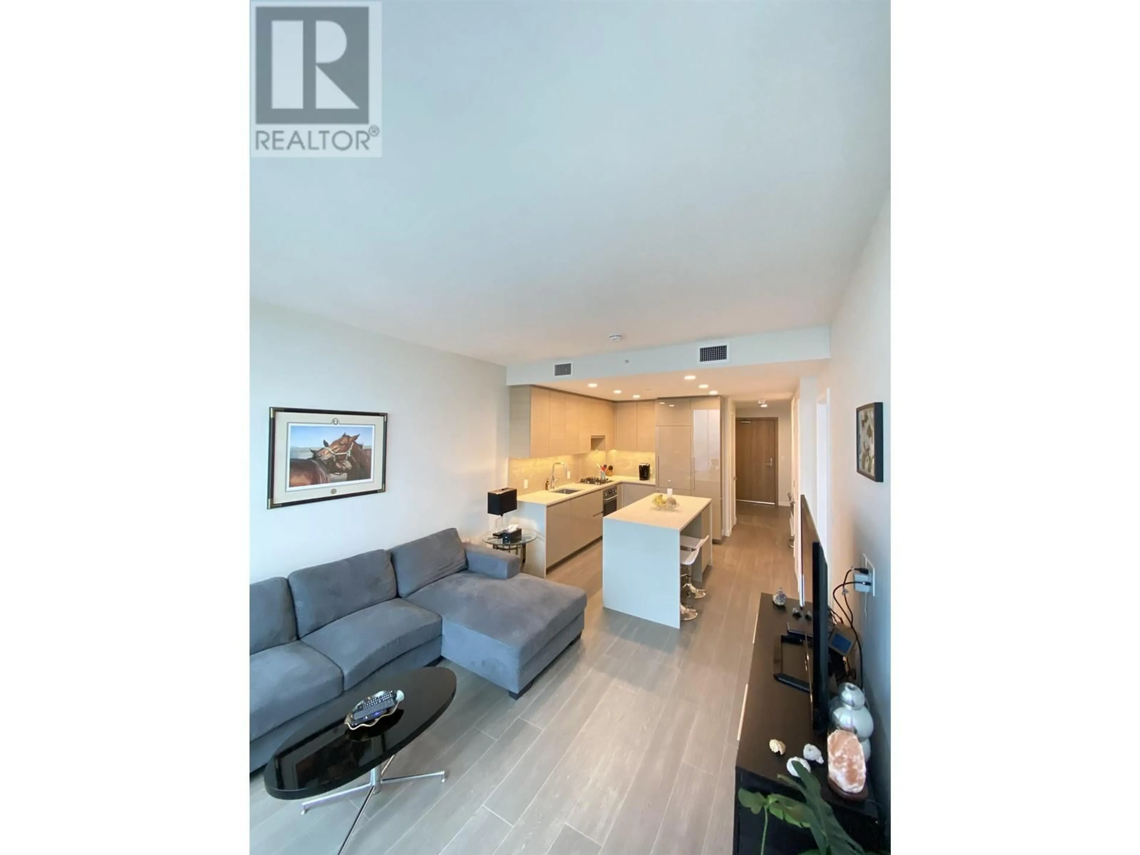 Living room with furniture, wood/laminate floor for 4409 - 2186 GILMORE AVENUE, Burnaby British Columbia V5C0N7