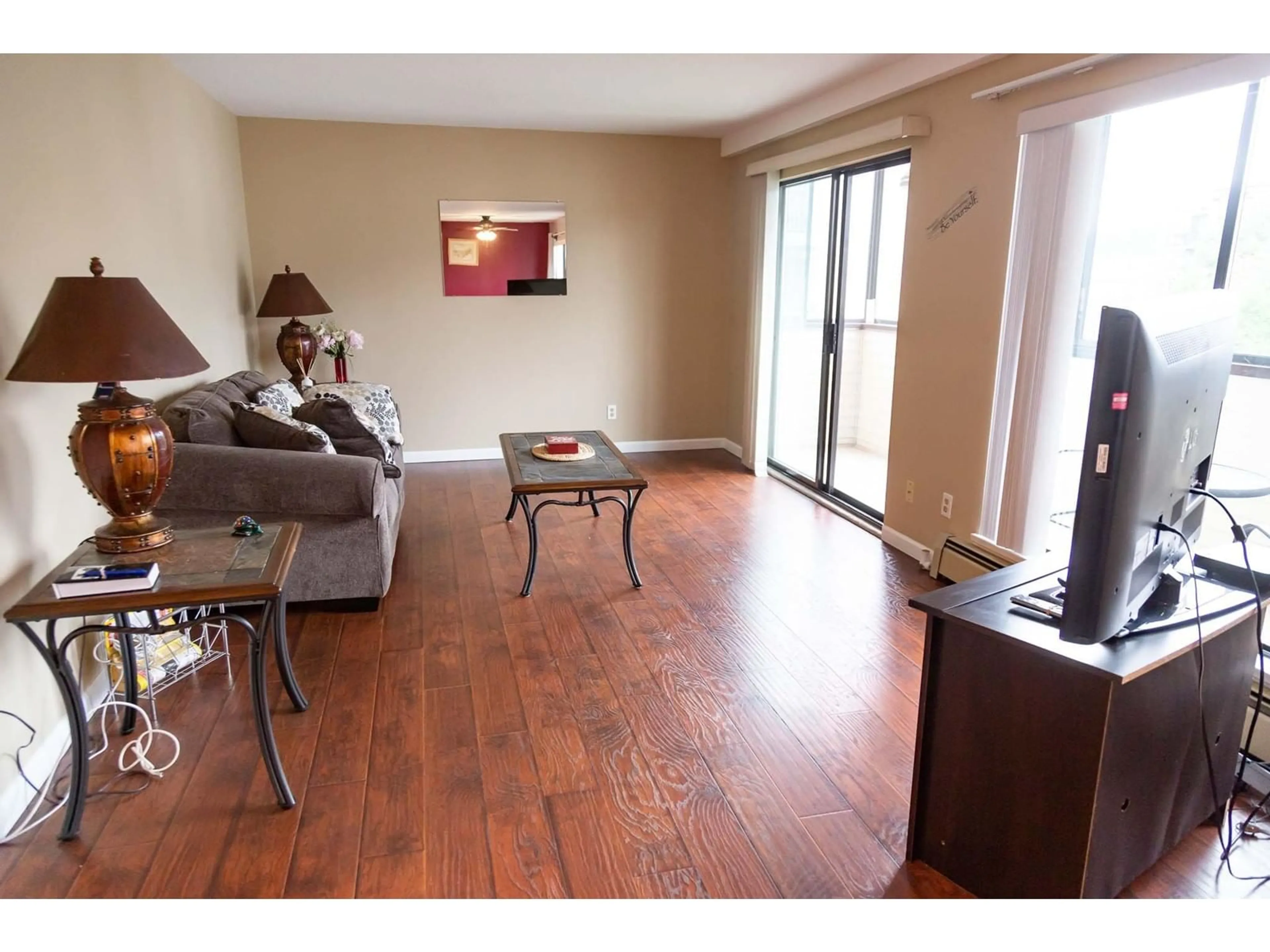 Living room with furniture, wood/laminate floor for 205 - 33369 OLD YALE, Abbotsford British Columbia V2S2J6