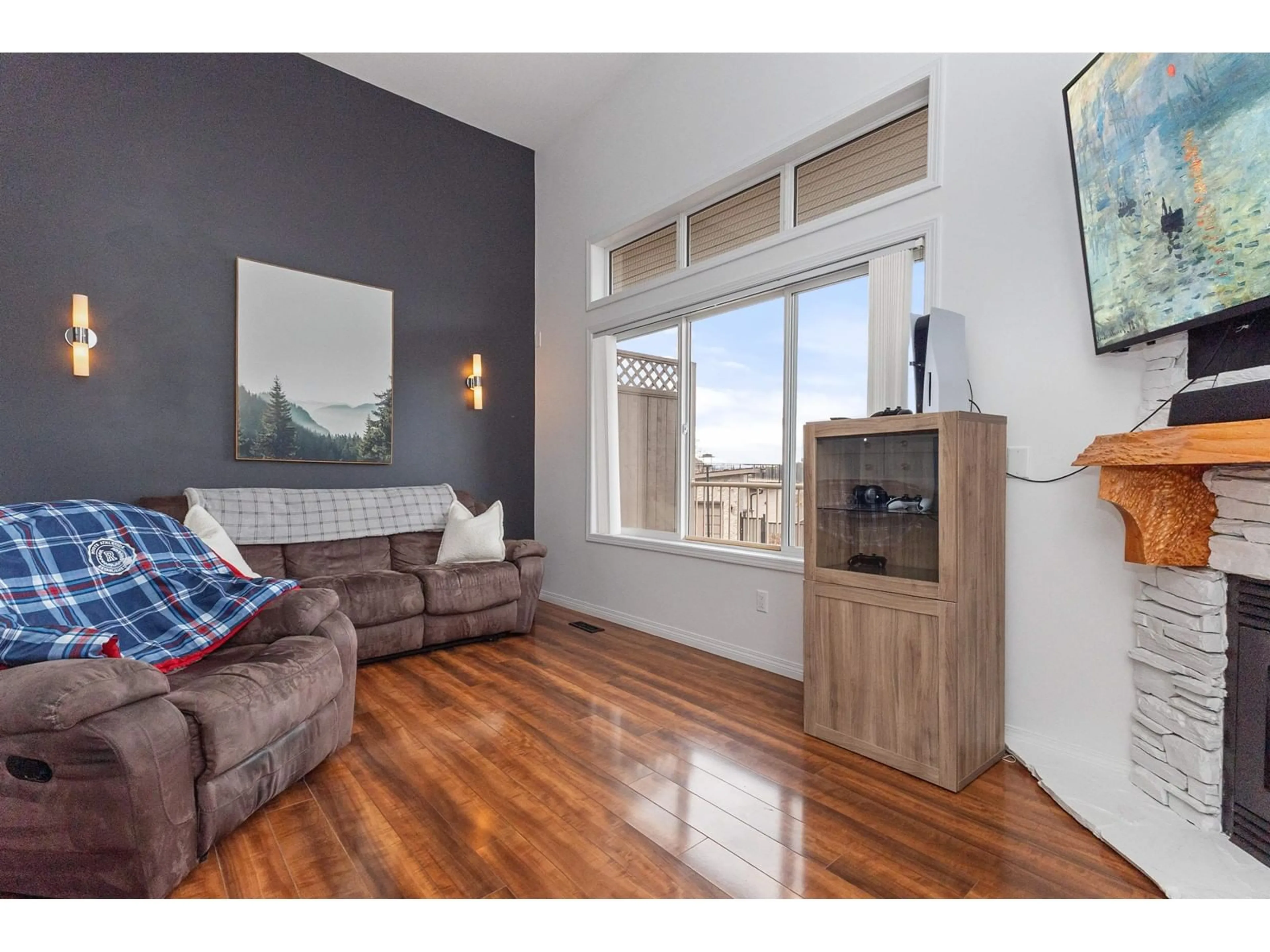 Living room with furniture, wood/laminate floor for 1401 - 5260 GOLDSPRING PLACE, Chilliwack British Columbia V2R5S5