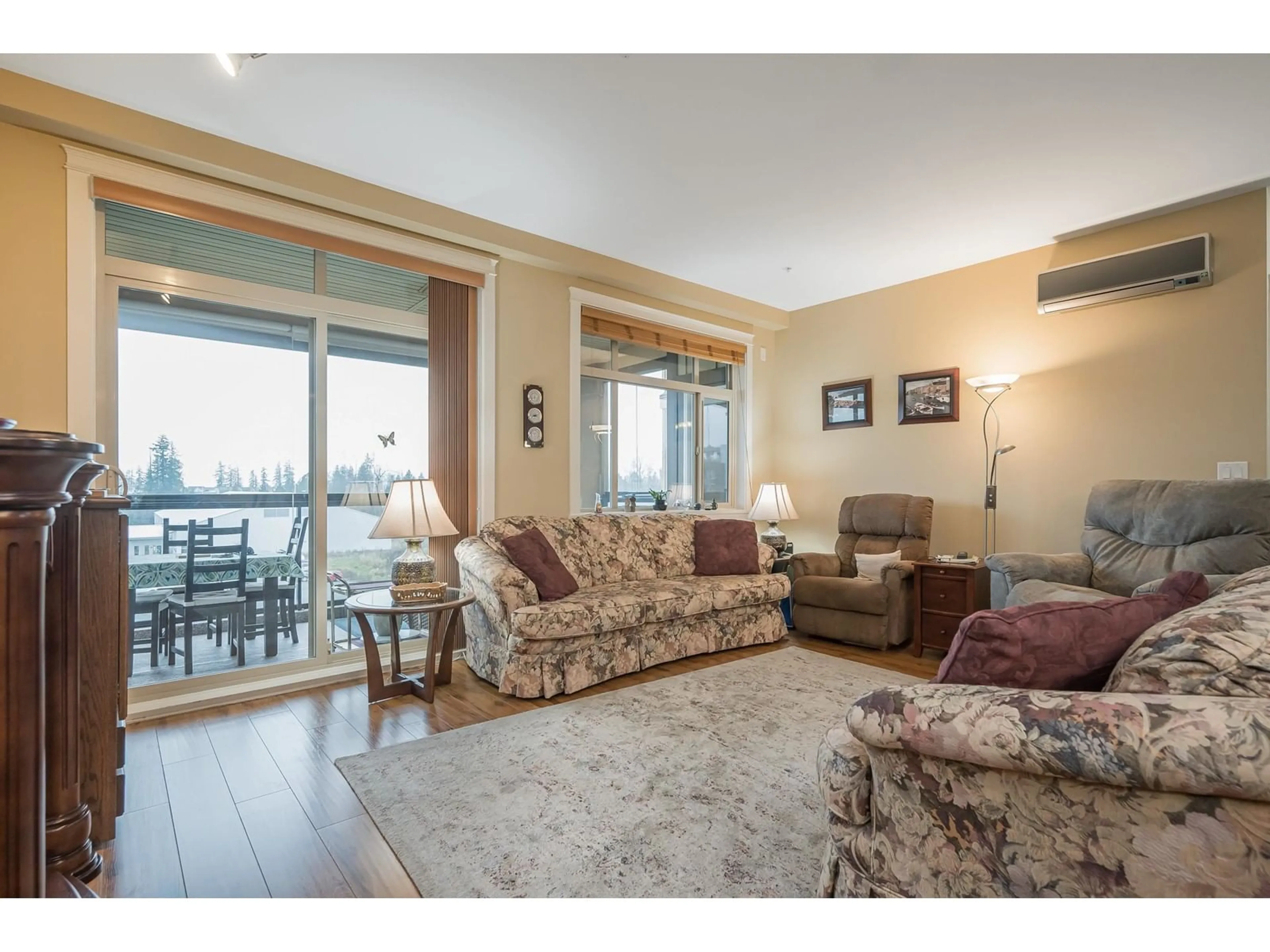 Living room with furniture, wood/laminate floor for 408 - 8067 207, Langley British Columbia V2Y0N9