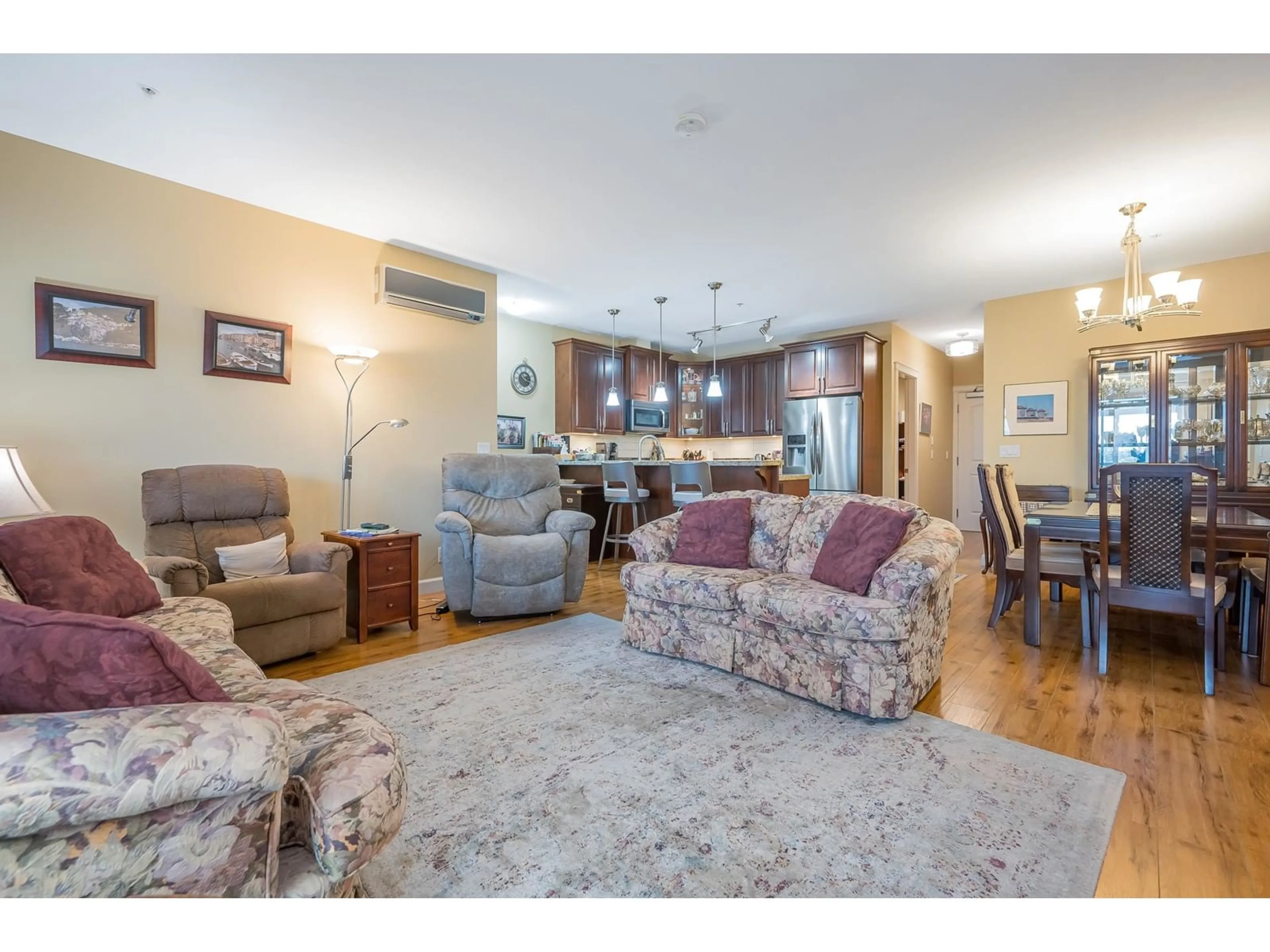 Living room with furniture, wood/laminate floor for 408 - 8067 207, Langley British Columbia V2Y0N9
