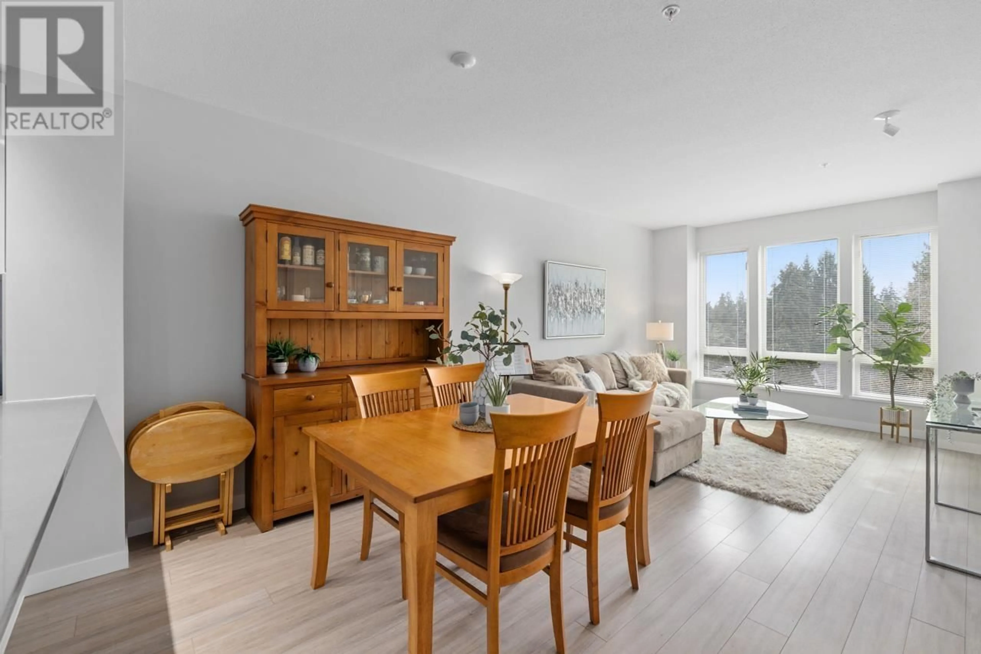 Dining room, wood/laminate floor for 410 - 2632 LIBRARY LANE, North Vancouver British Columbia V7J0B8