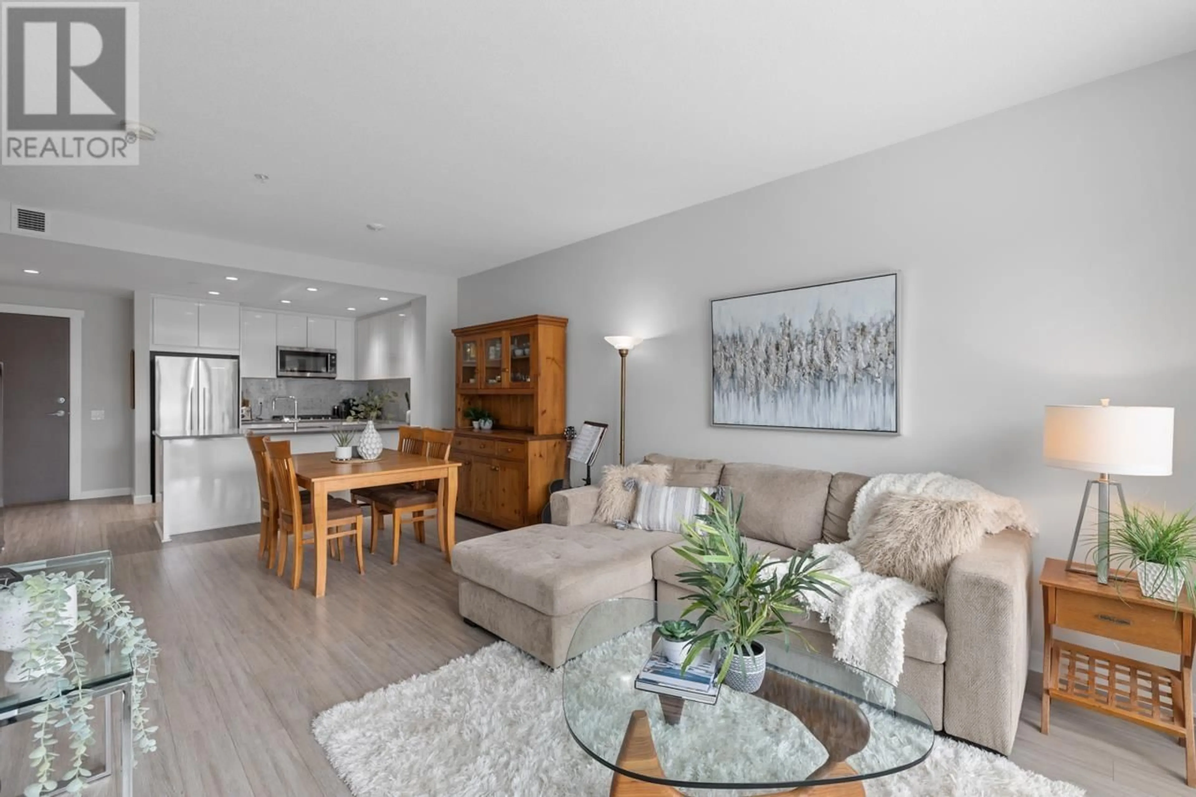 Living room with furniture, wood/laminate floor for 410 - 2632 LIBRARY LANE, North Vancouver British Columbia V7J0B8