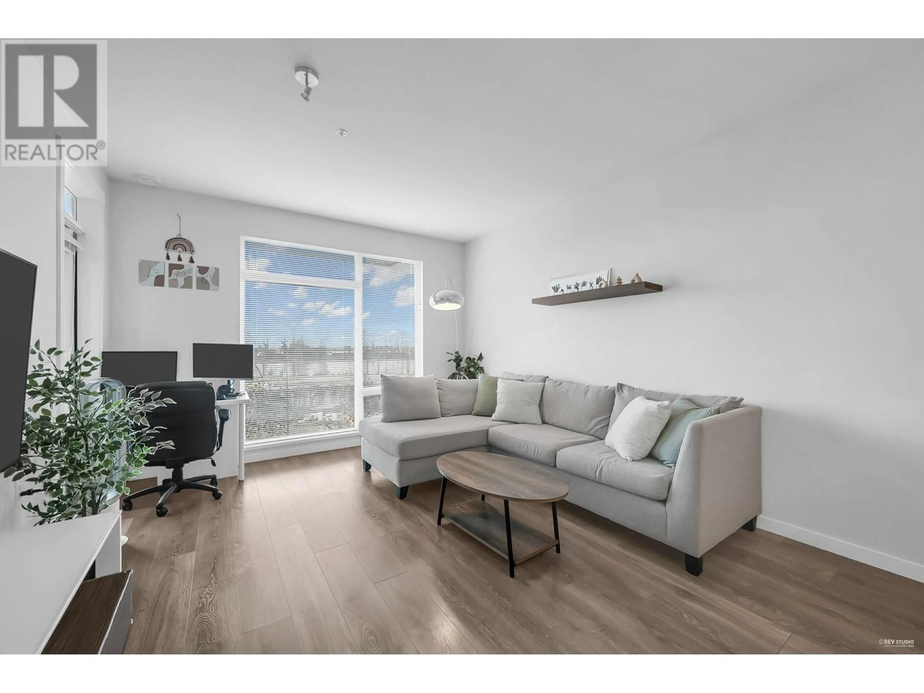 Living room with furniture, wood/laminate floor for 403 - 3289 RIVERWALK AVENUE, Vancouver British Columbia V5S0G2