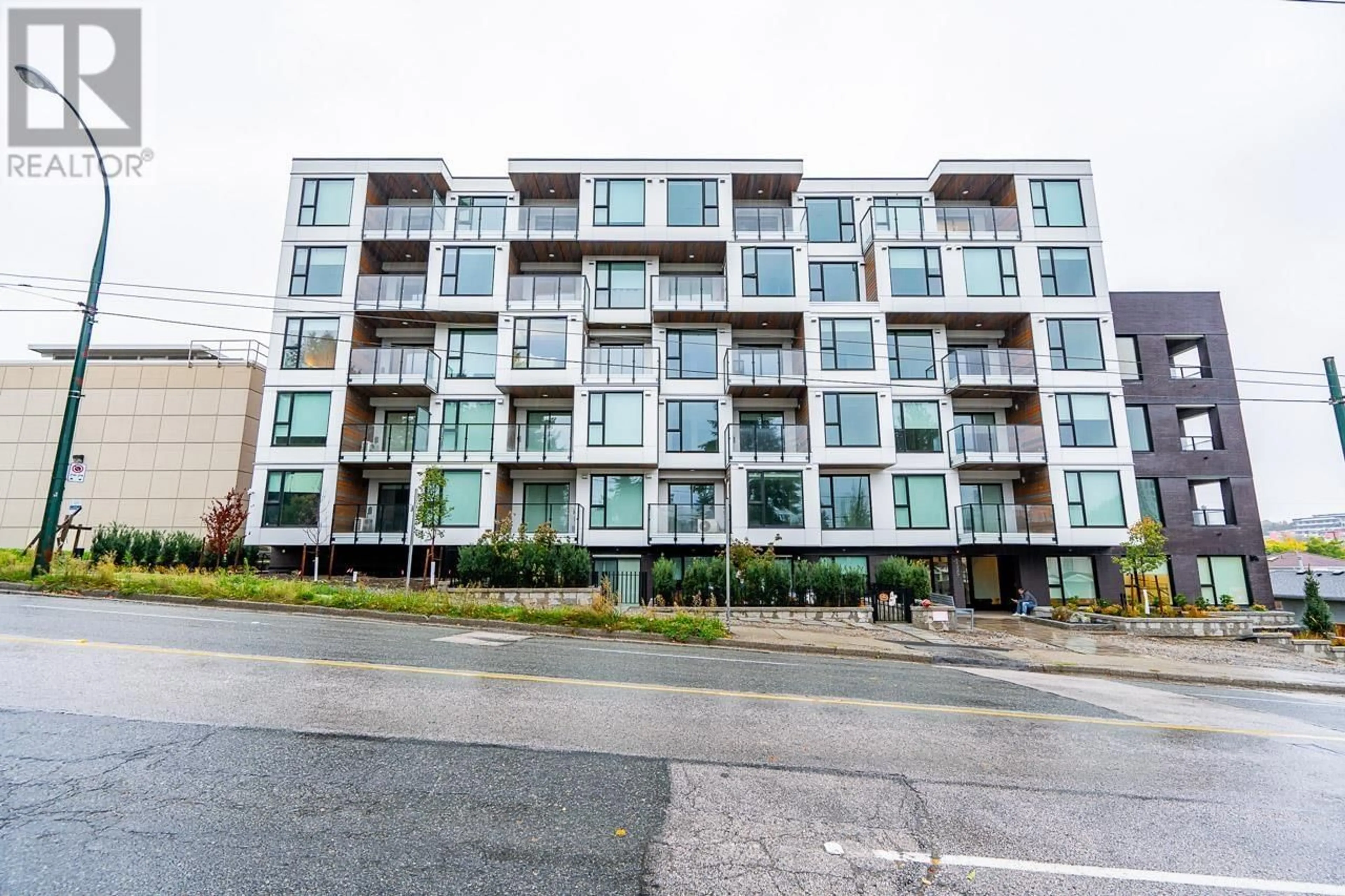 A pic from outside/outdoor area/front of a property/back of a property/a pic from drone, building for 406 - 5399 JOYCE STREET, Vancouver British Columbia V5R4H3