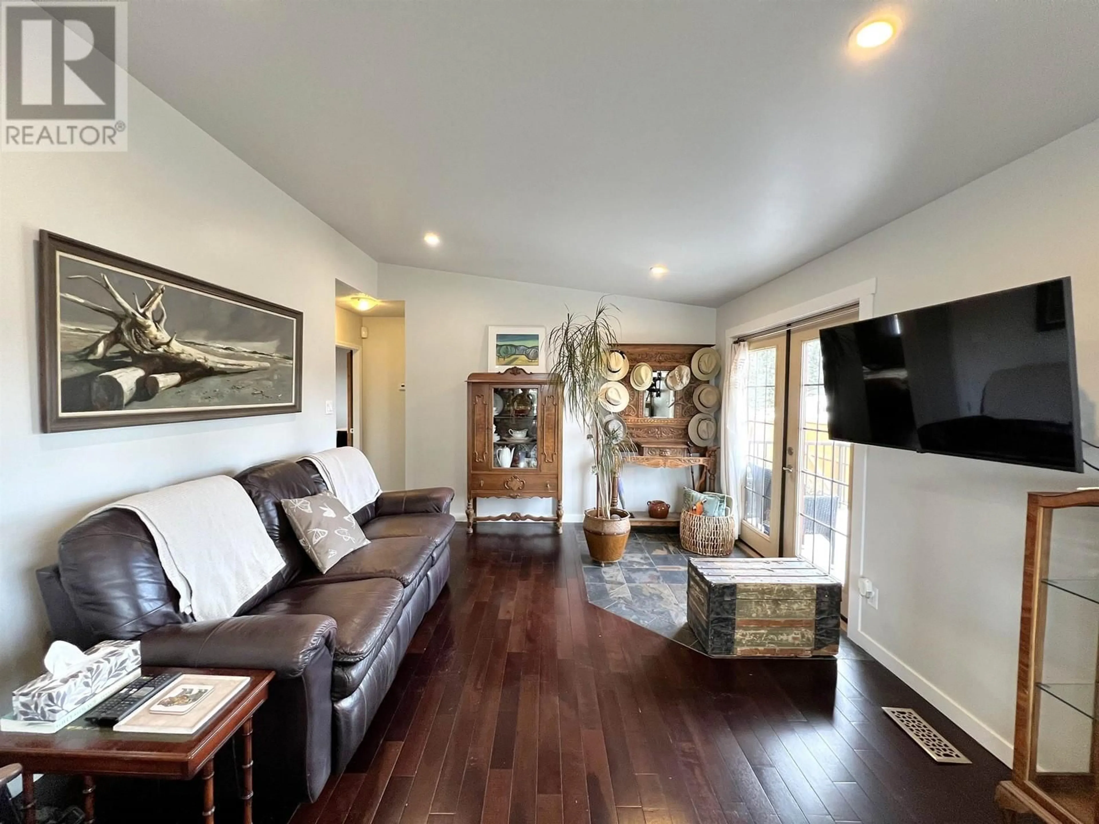 Living room with furniture, wood/laminate floor for 305 KELLY STREET, Prince George British Columbia V2M3K4