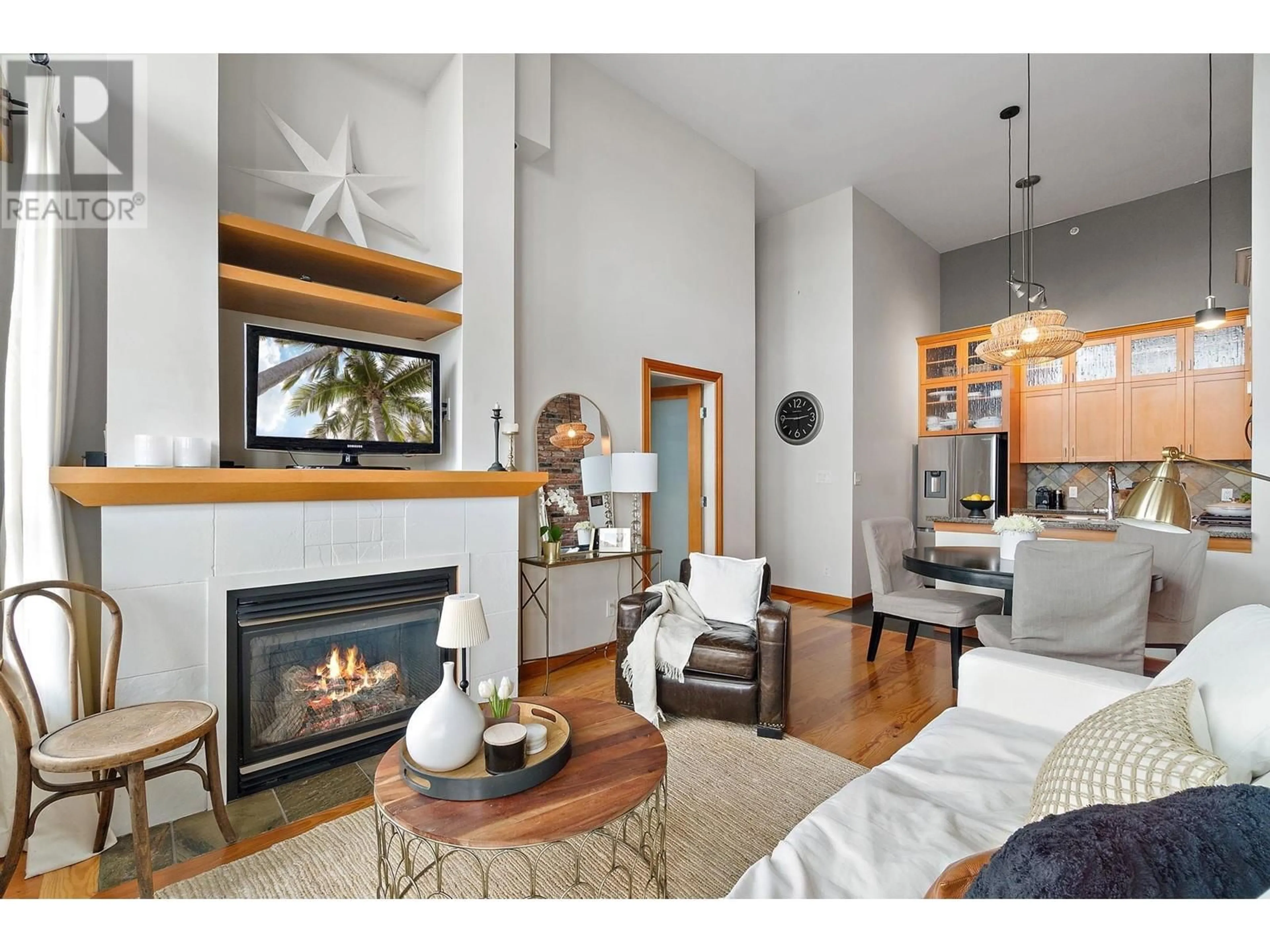 Living room with furniture, wood/laminate floor for 602 - 7 RIALTO COURT, New Westminster British Columbia V3M7A8