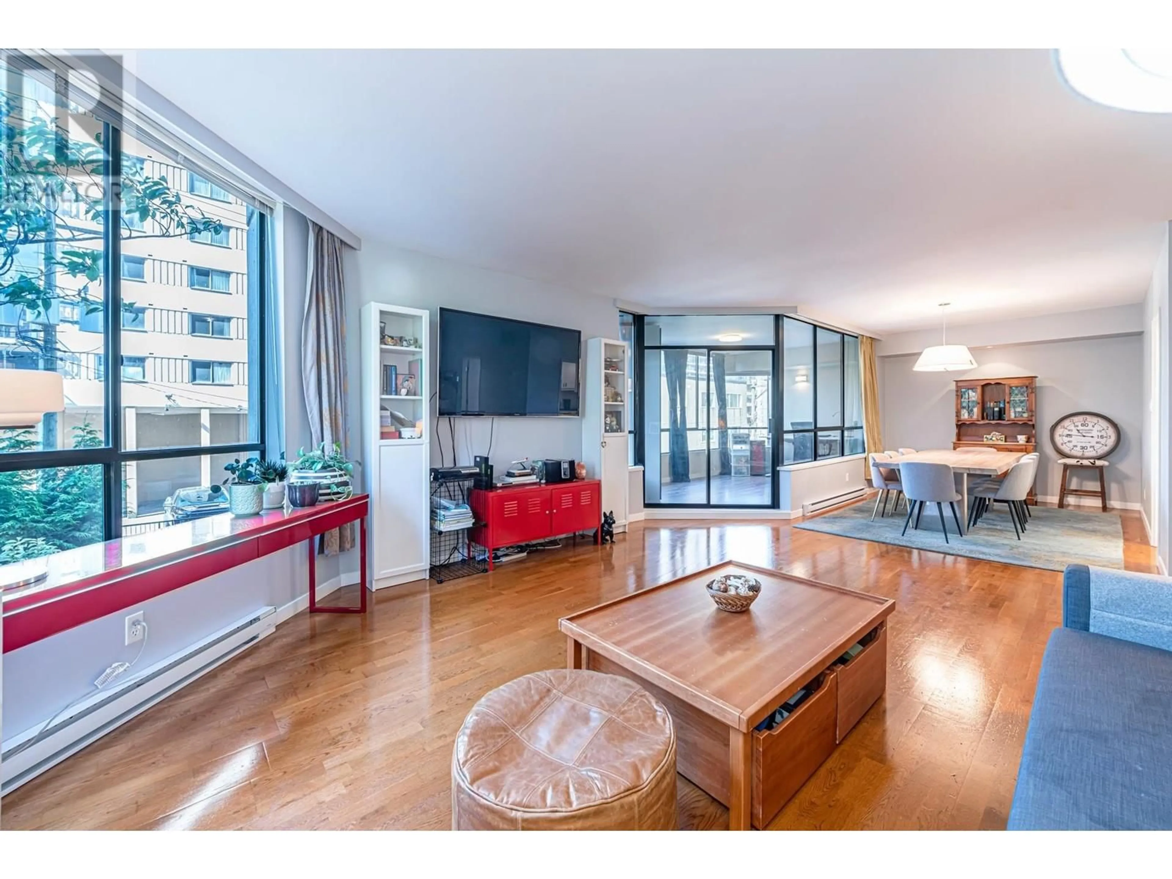 Living room with furniture, wood/laminate floor for 203 - 738 BROUGHTON STREET, Vancouver British Columbia V6G3A7