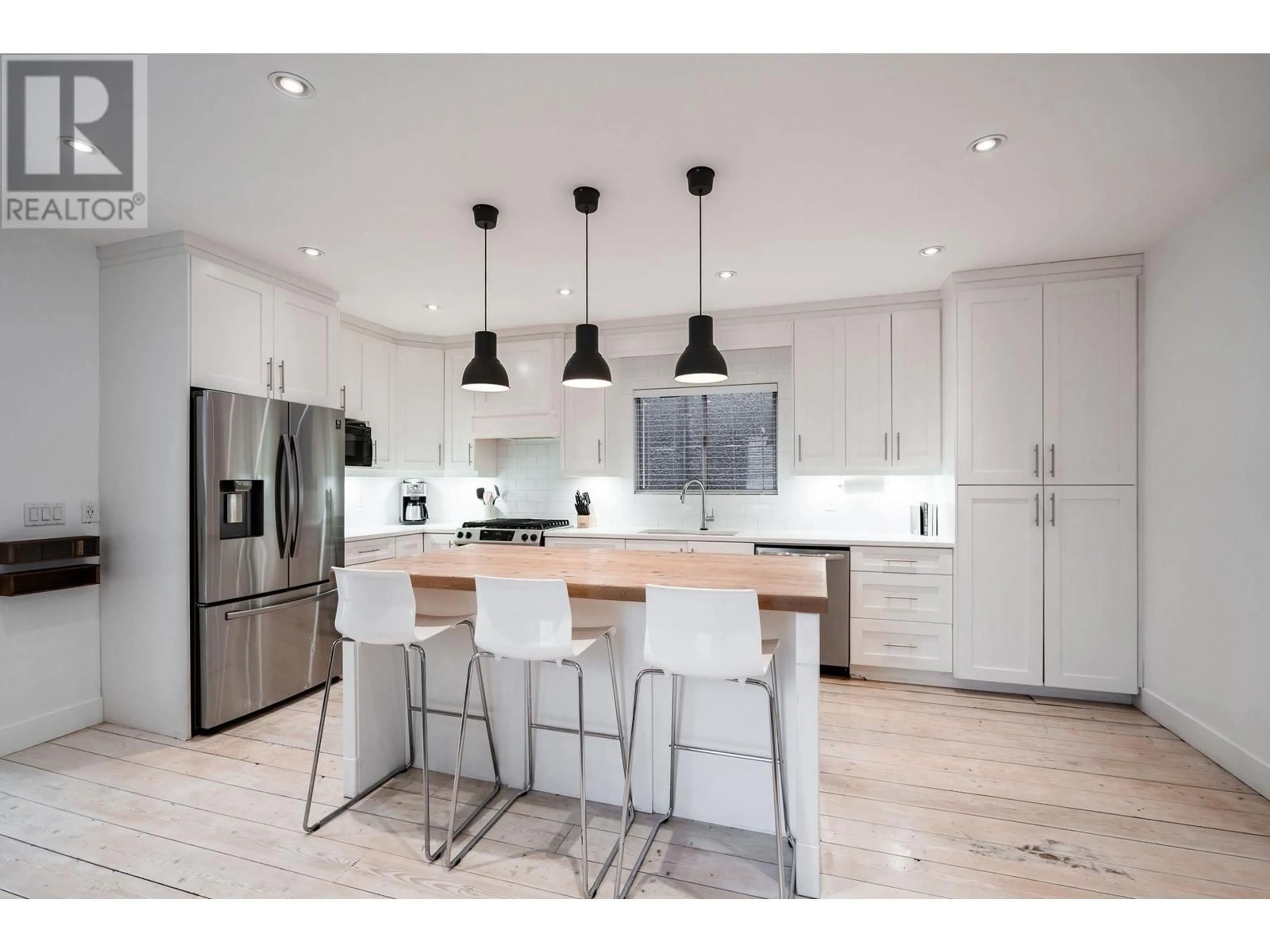Contemporary kitchen, wood/laminate floor for 1121 KEEFER STREET, Vancouver British Columbia V6A1Z2