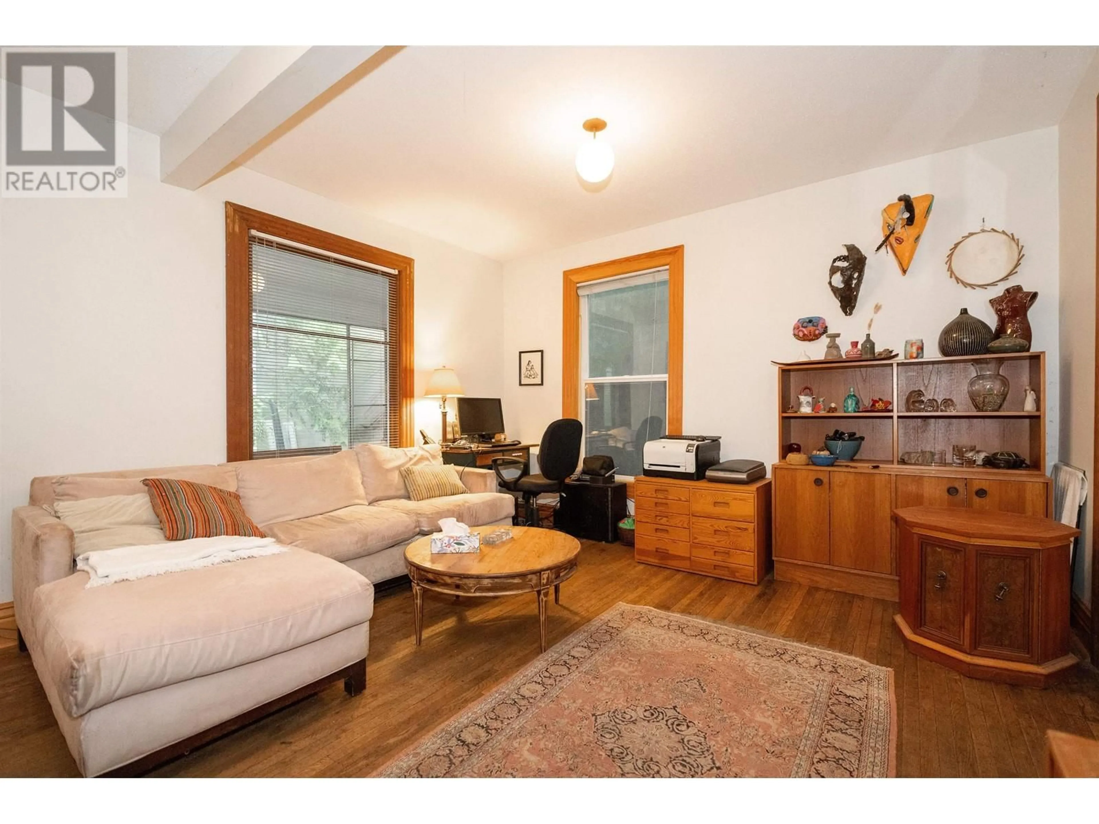 Living room with furniture, wood/laminate floor for 1828 TRIUMPH STREET, Vancouver British Columbia V5L1K3