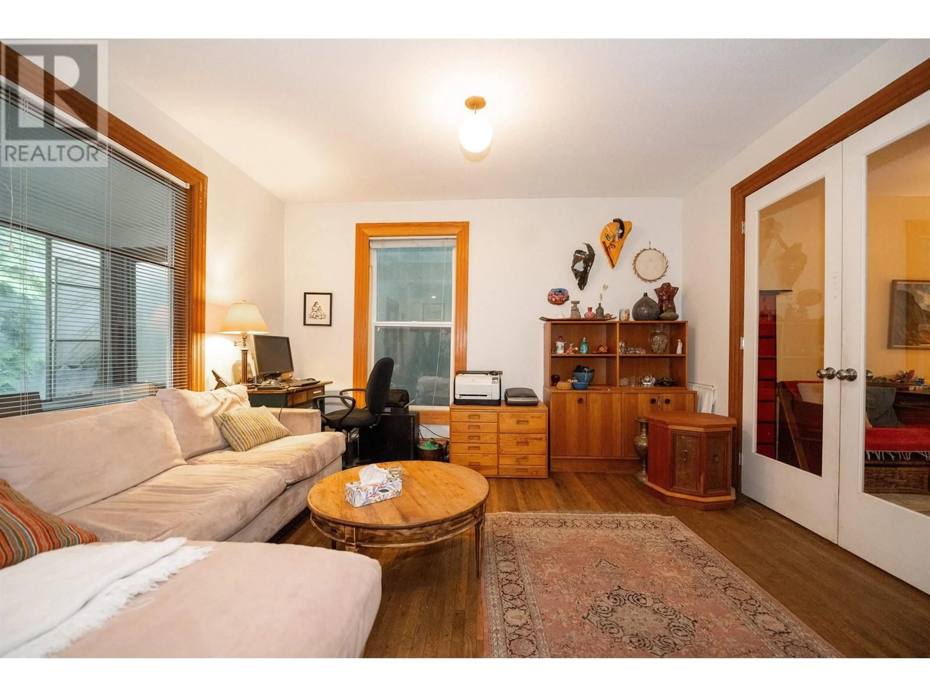 Living room with furniture, wood/laminate floor for 1828 TRIUMPH STREET, Vancouver British Columbia V5L1K3