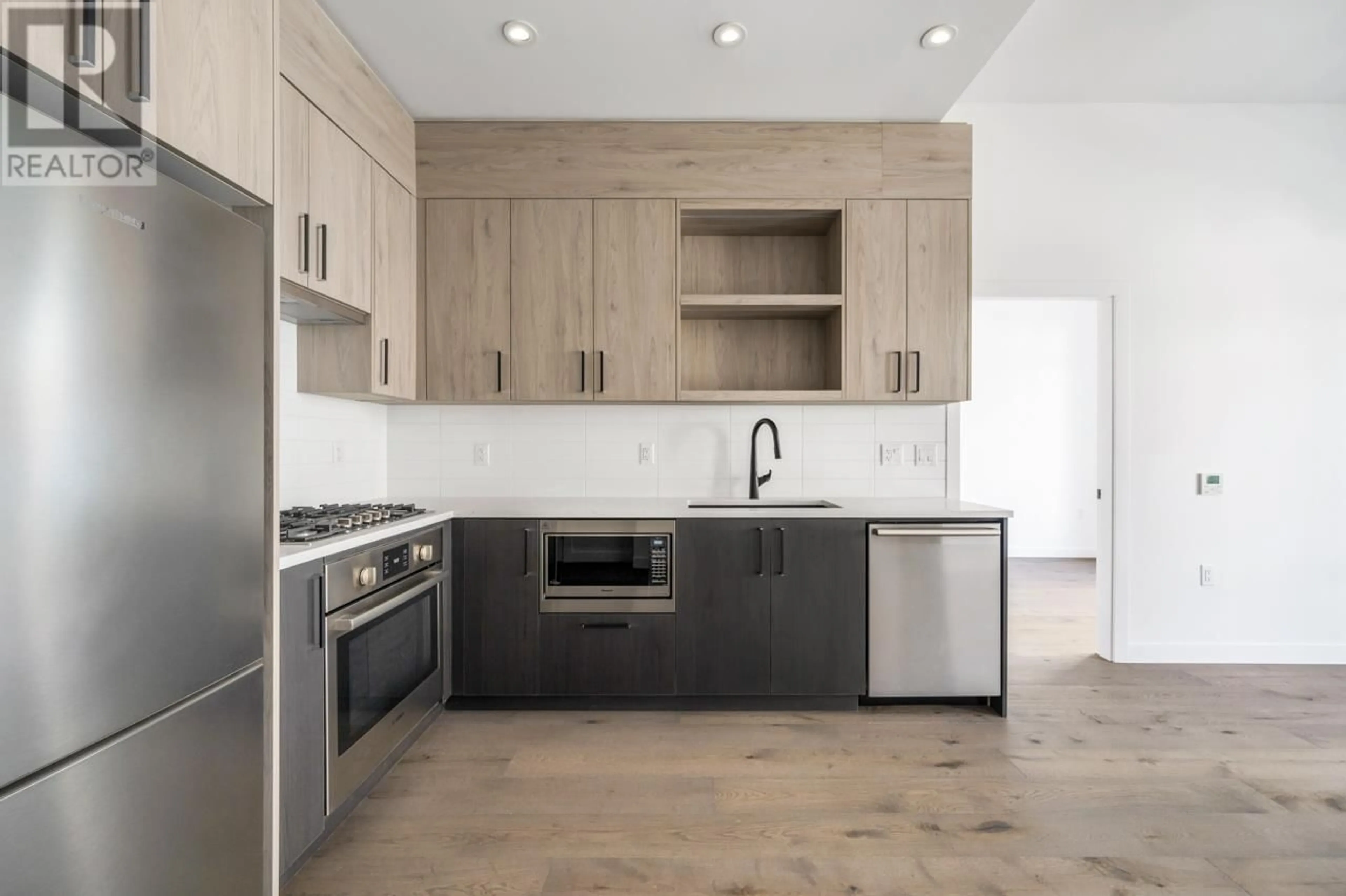 Open concept kitchen, ceramic/tile floor for 104 - 6859 CAMBIE STREET, Vancouver British Columbia V6P0M4