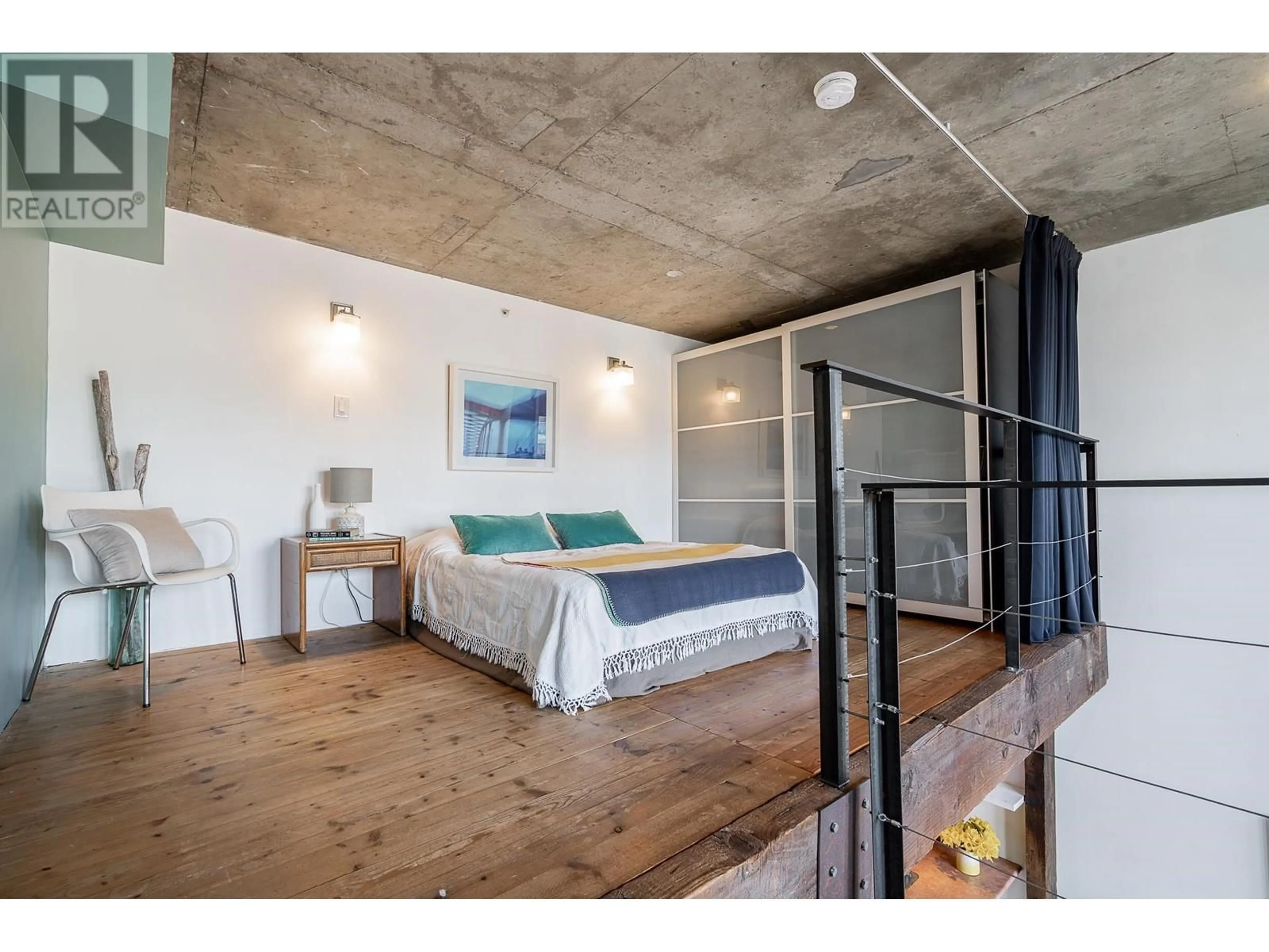 Bedroom with bed, cement floor for 509 - 22 CORDOVA STREET, Vancouver British Columbia V6A4G8