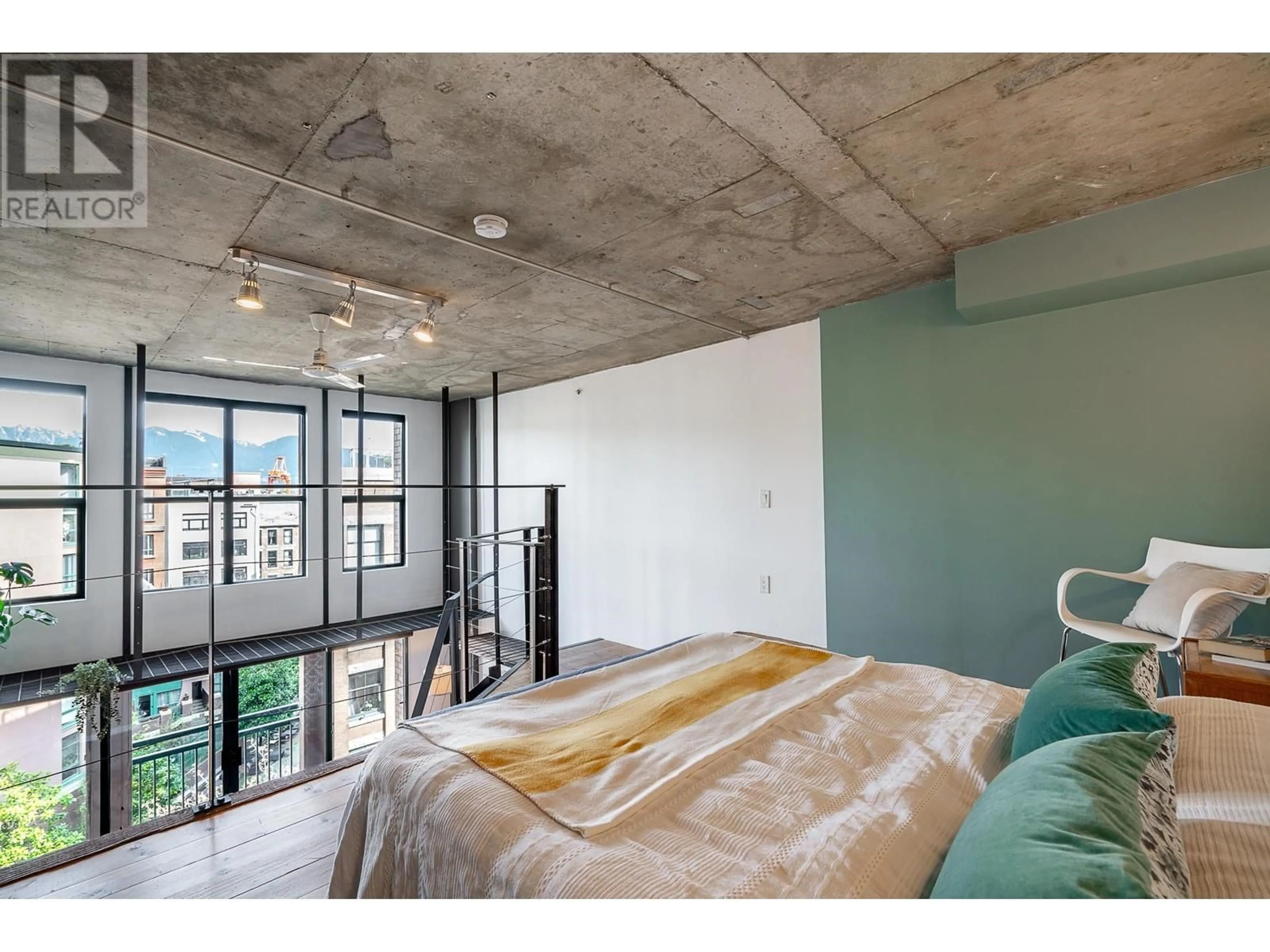 Bedroom with bed, cement floor for 509 - 22 CORDOVA STREET, Vancouver British Columbia V6A4G8